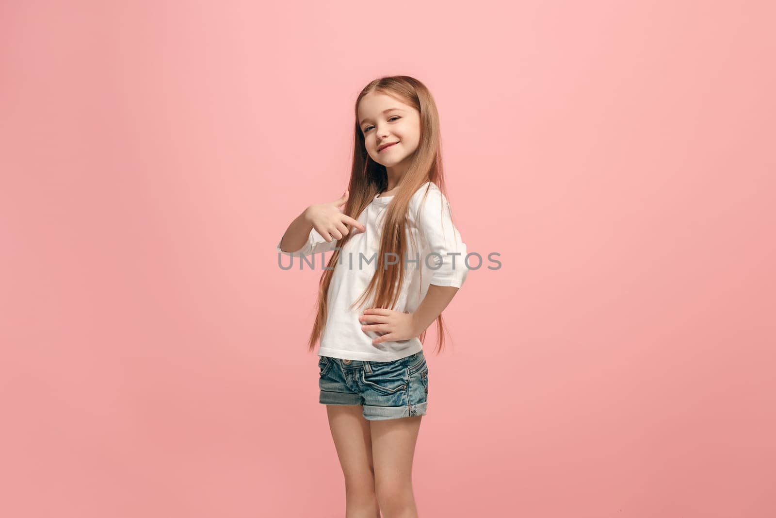 I won. Winning success happy teen girl celebrating being a winner. Dynamic image of caucasian female model on pink studio background. Victory, delight concept. Human facial emotions concept. Trendy colors