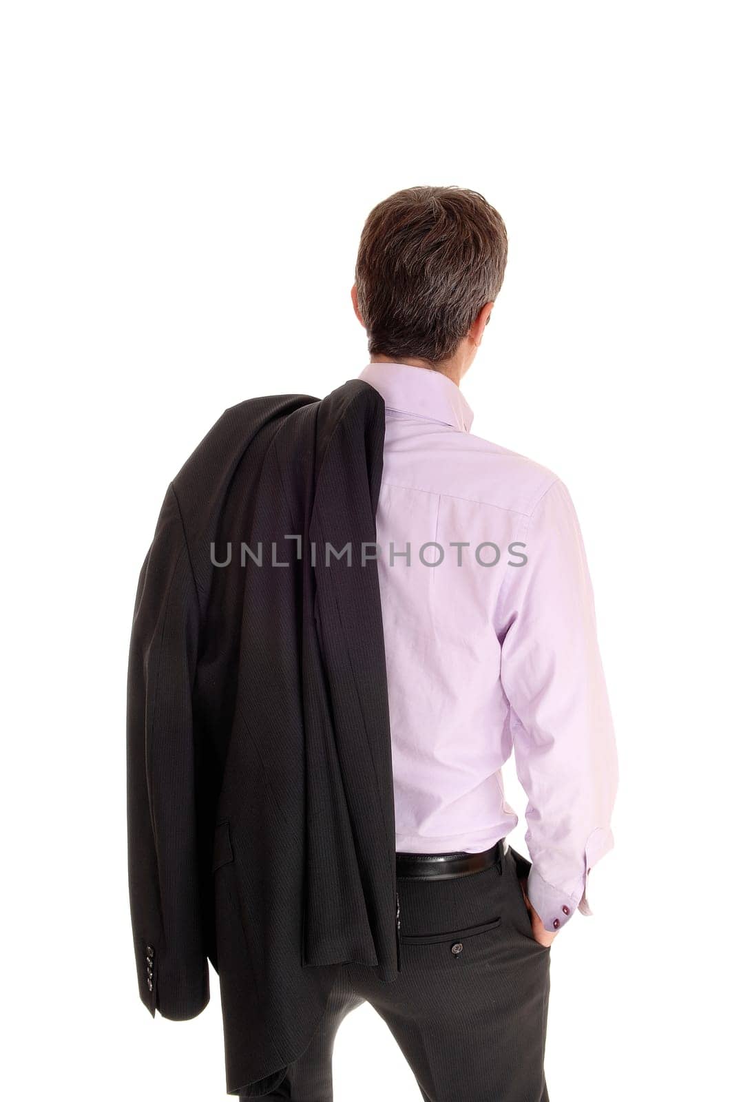 A handsome young businessman standing from the back with his jacket.over his shoulder, isolated for white background.