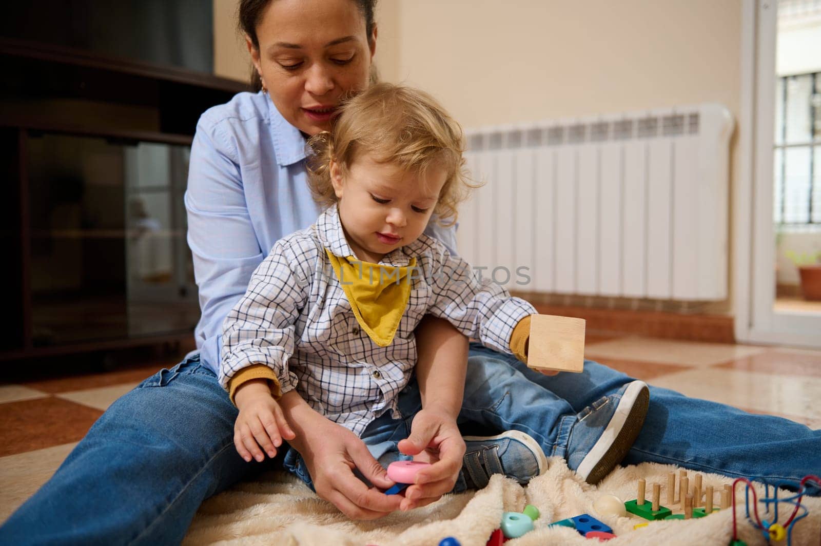 A mother and her toddler playing together at home, sharing moments of joy and connection during their daytime activities.