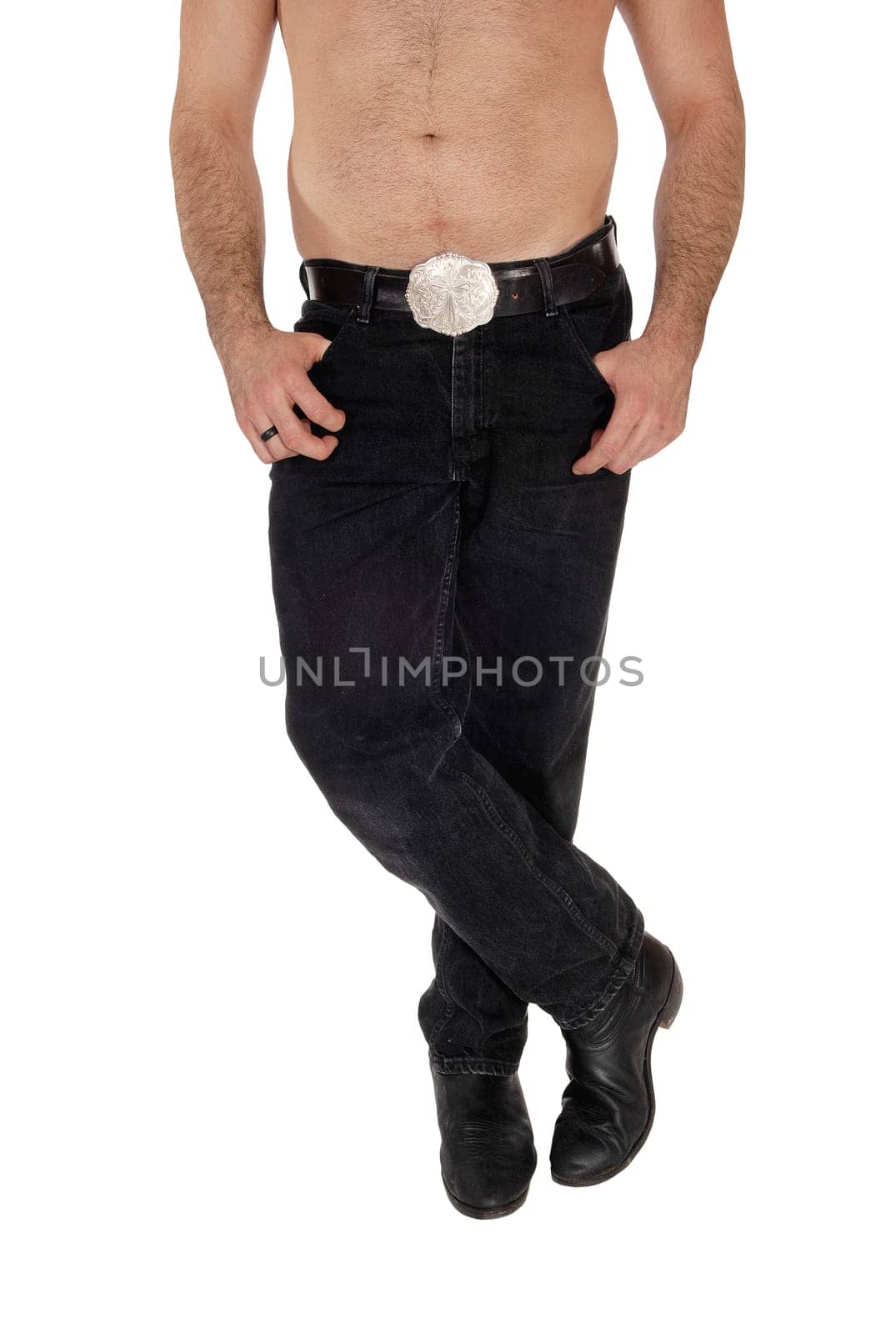 A close up image of the legs and torsos a young man shirtless standing.with his legs crossed and big belt, isolated for white background.