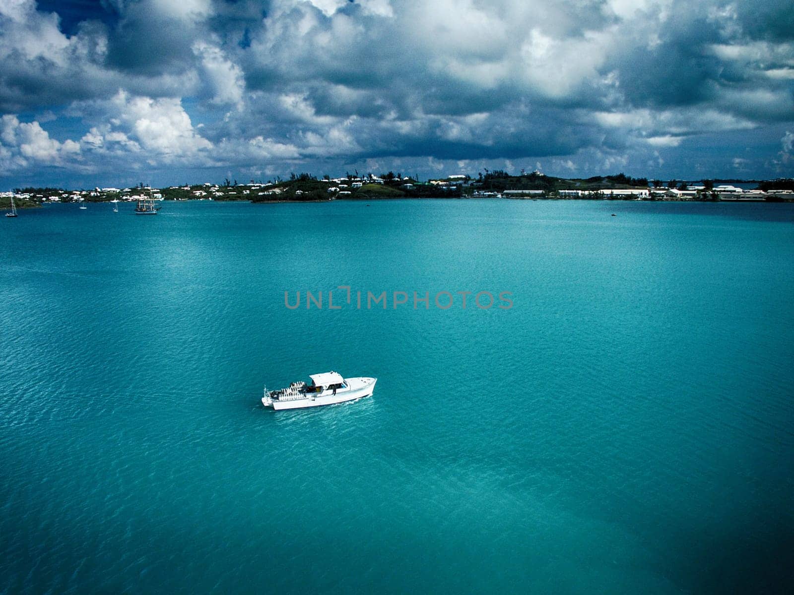 Boat in bay. Cloudy sky