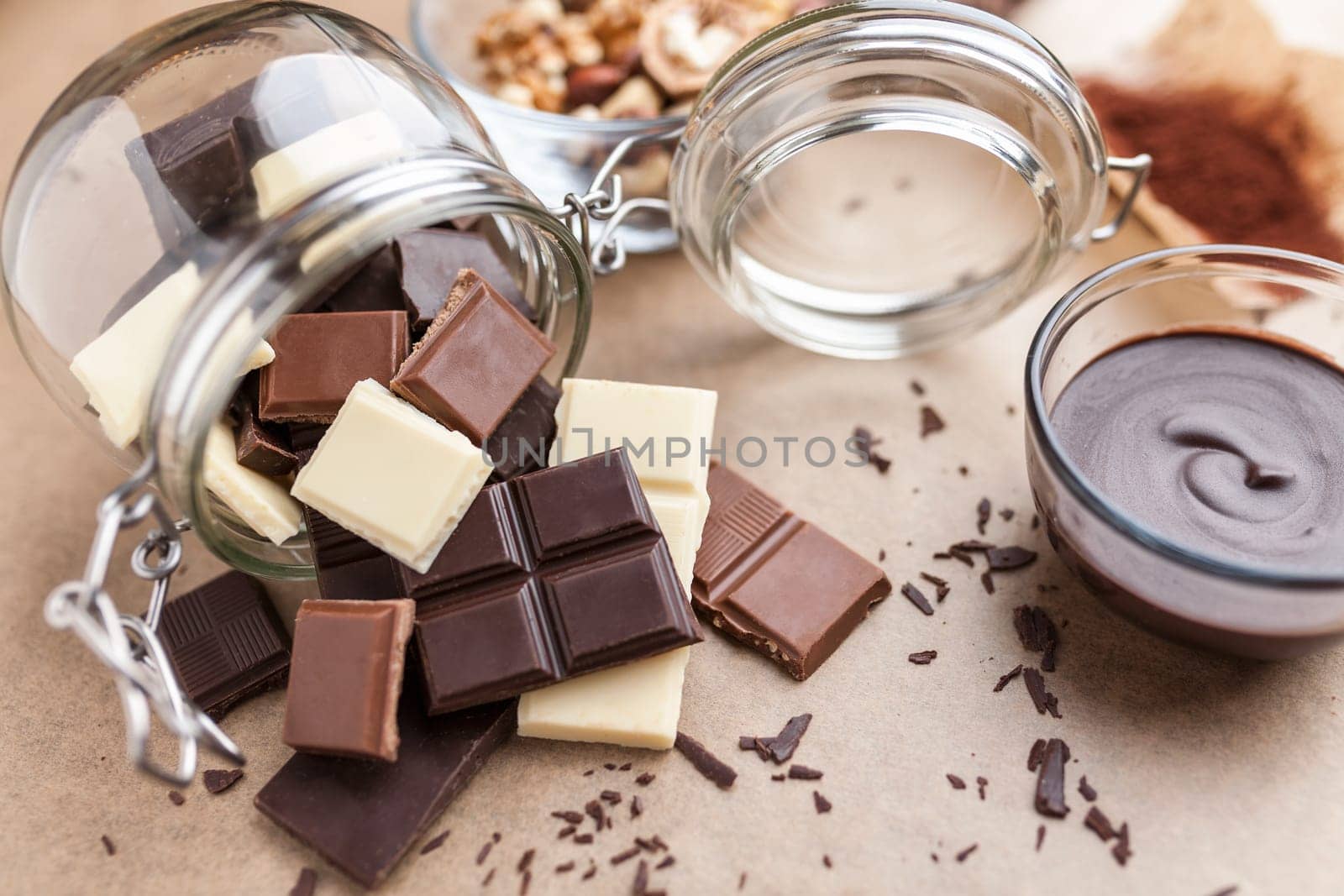 Variety of delicious chocolate bars in a jar