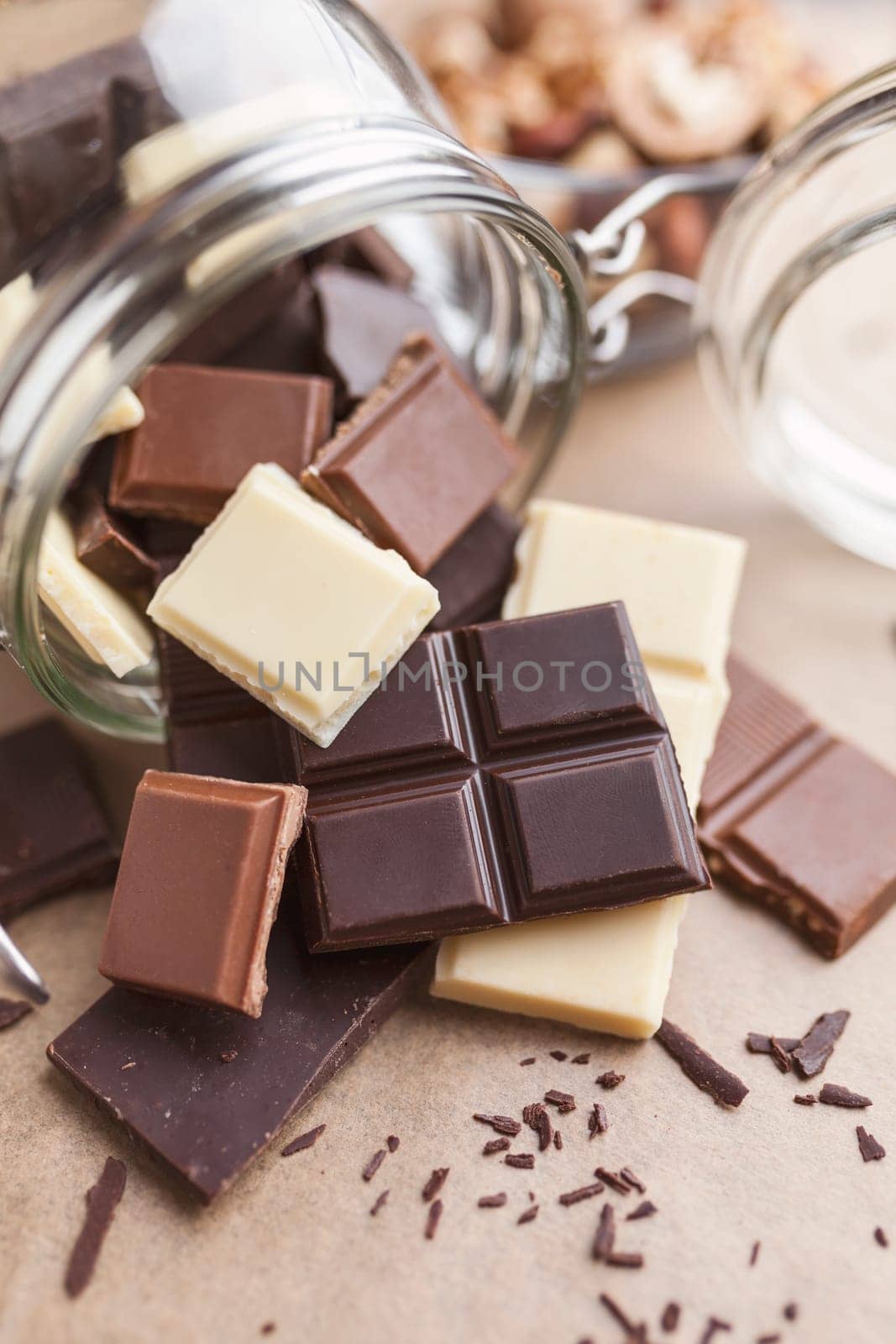 Variety of delicious chocolate bars in a jar