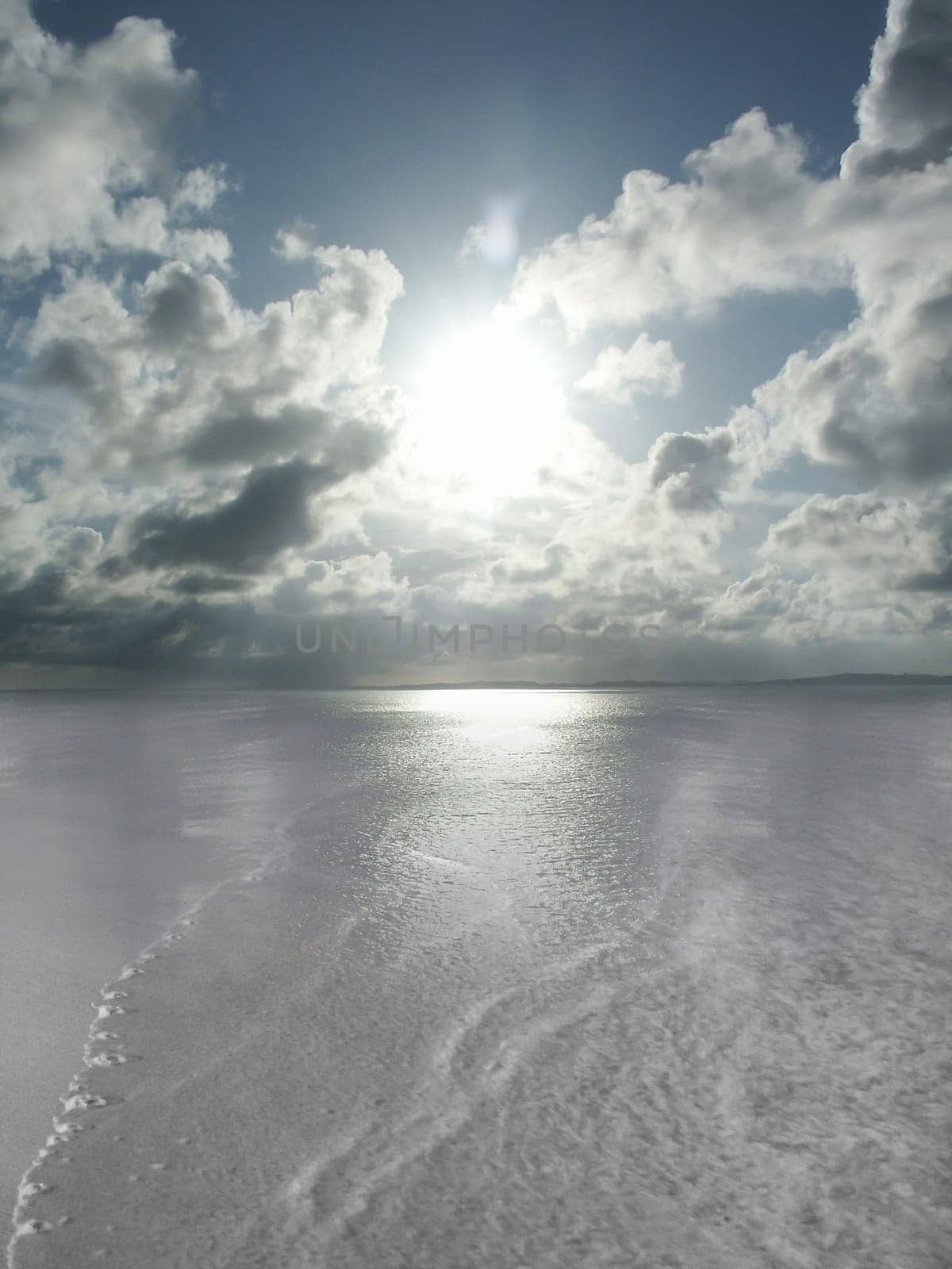 Calm low tide. Conceptual sunset or sunrise at sea or ocean horizon