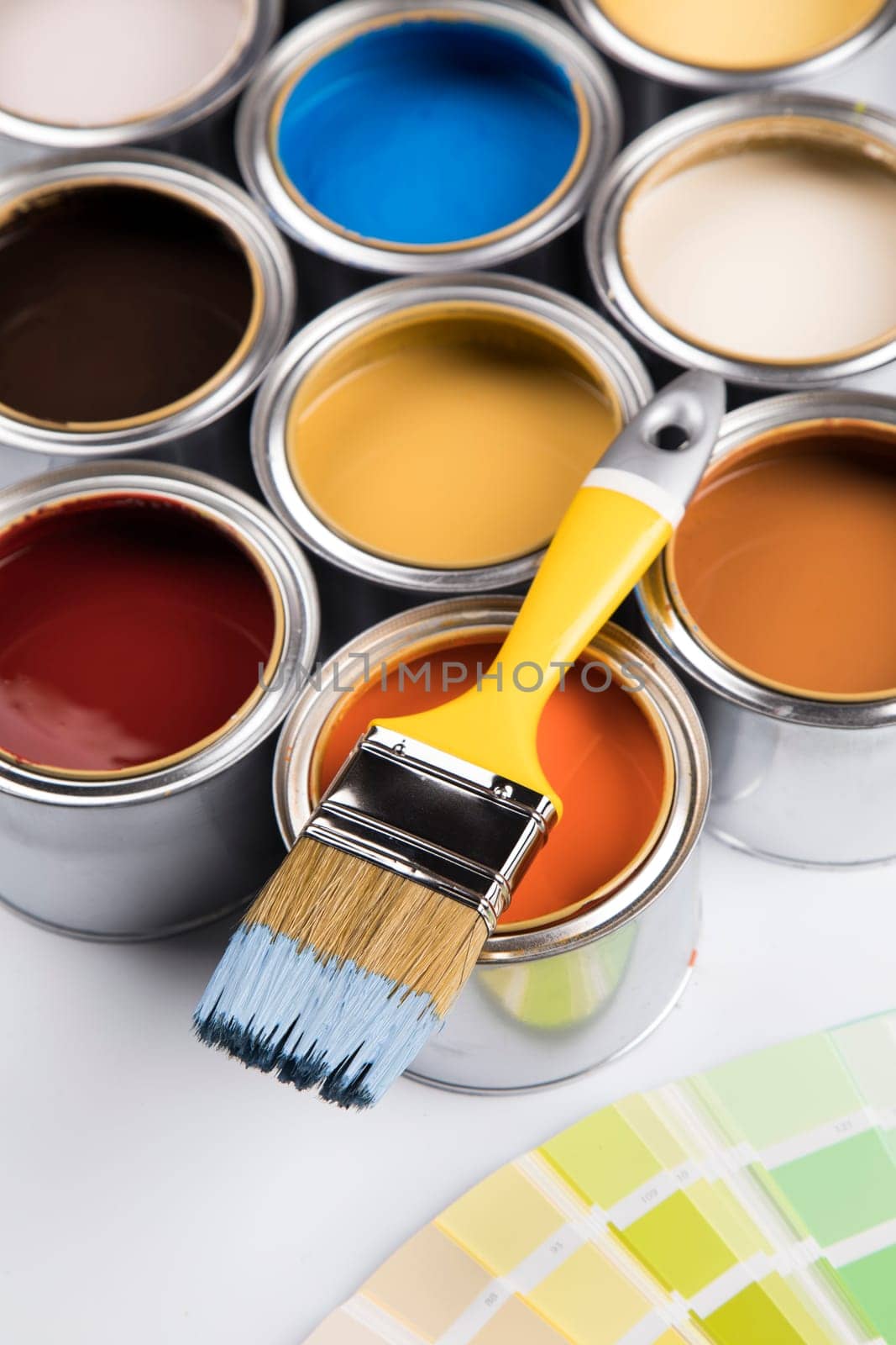 Paint can with a paintbrush