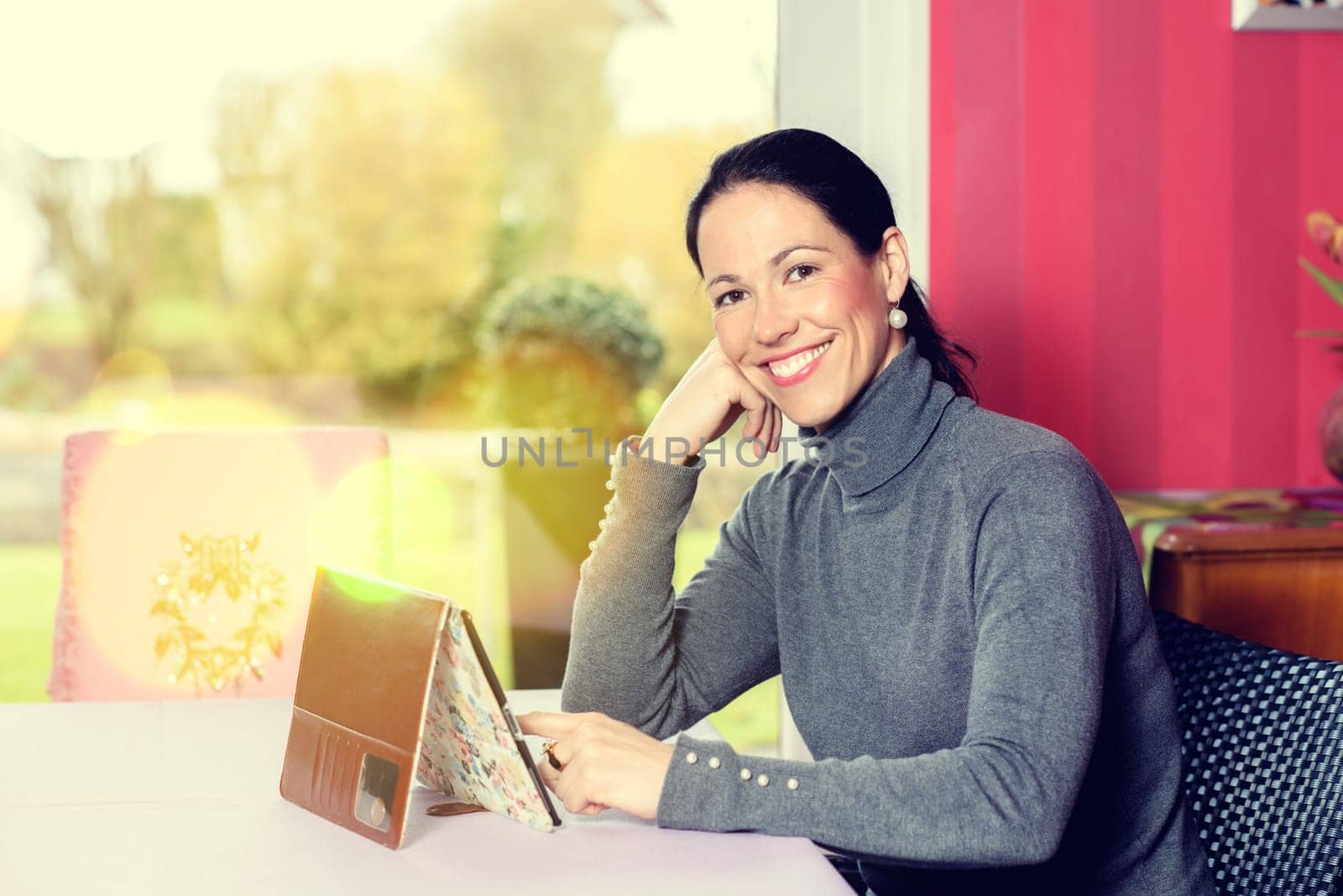 young woman at home using tablet pc
