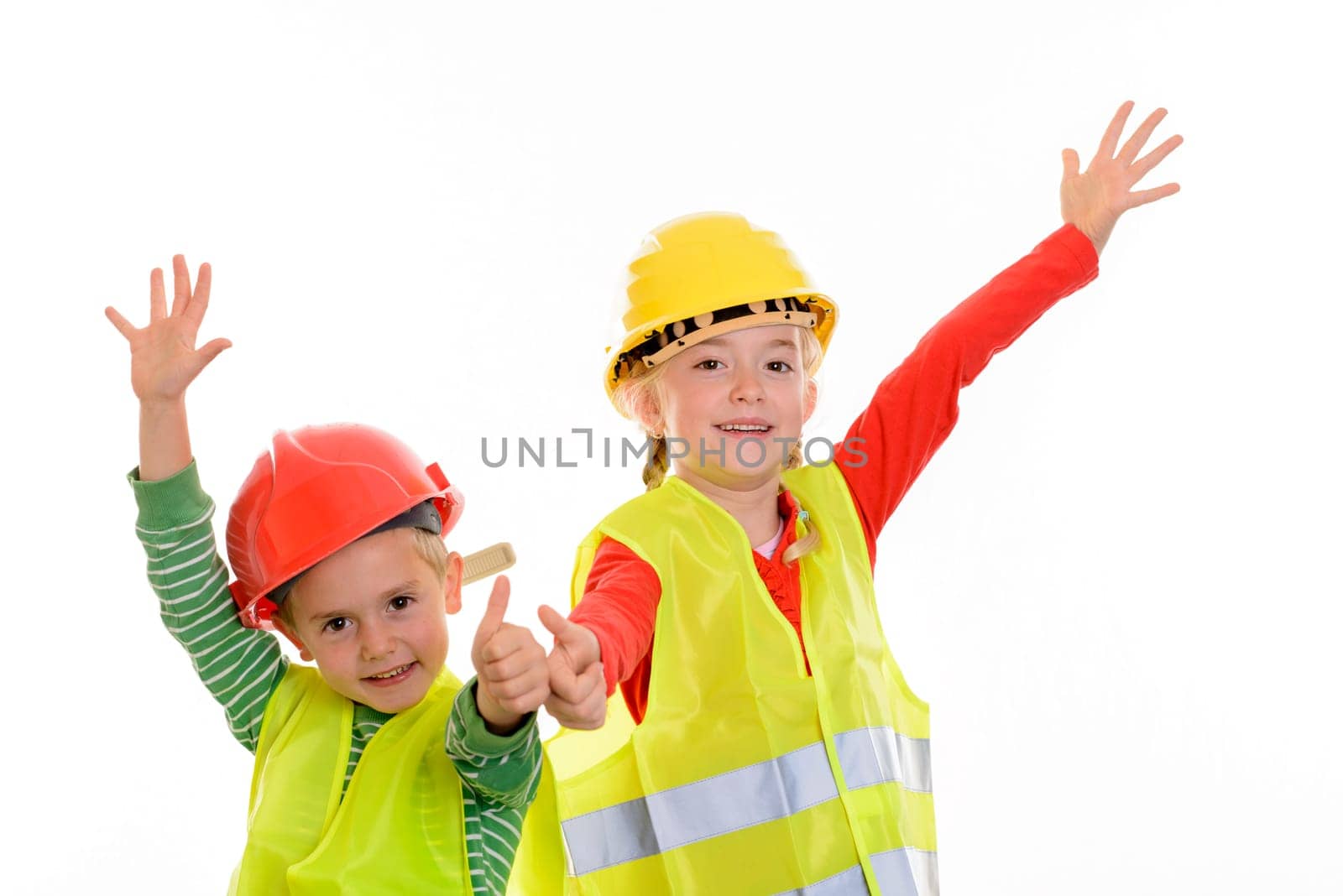 boy and girl with reflective vest and helmet in front of white background