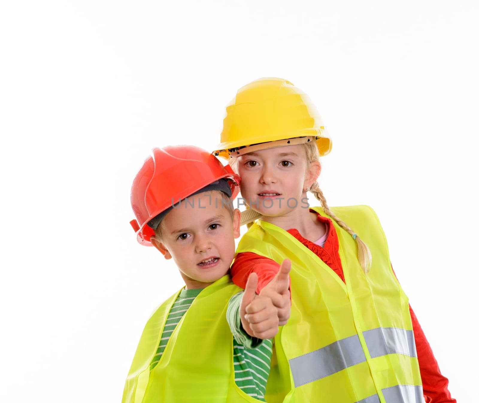 boy and girl with reflective vest and helmet in front of white background