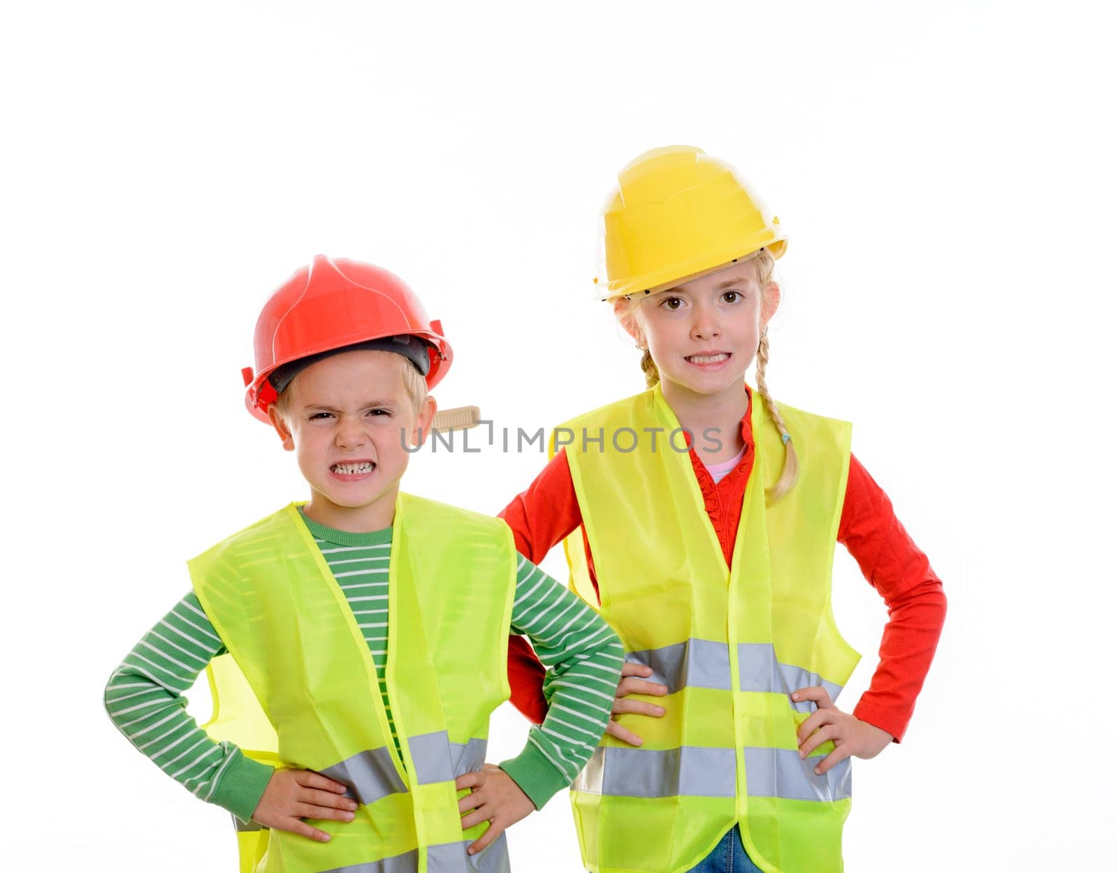 boy and girl with reflective vest and helmet in front of white background