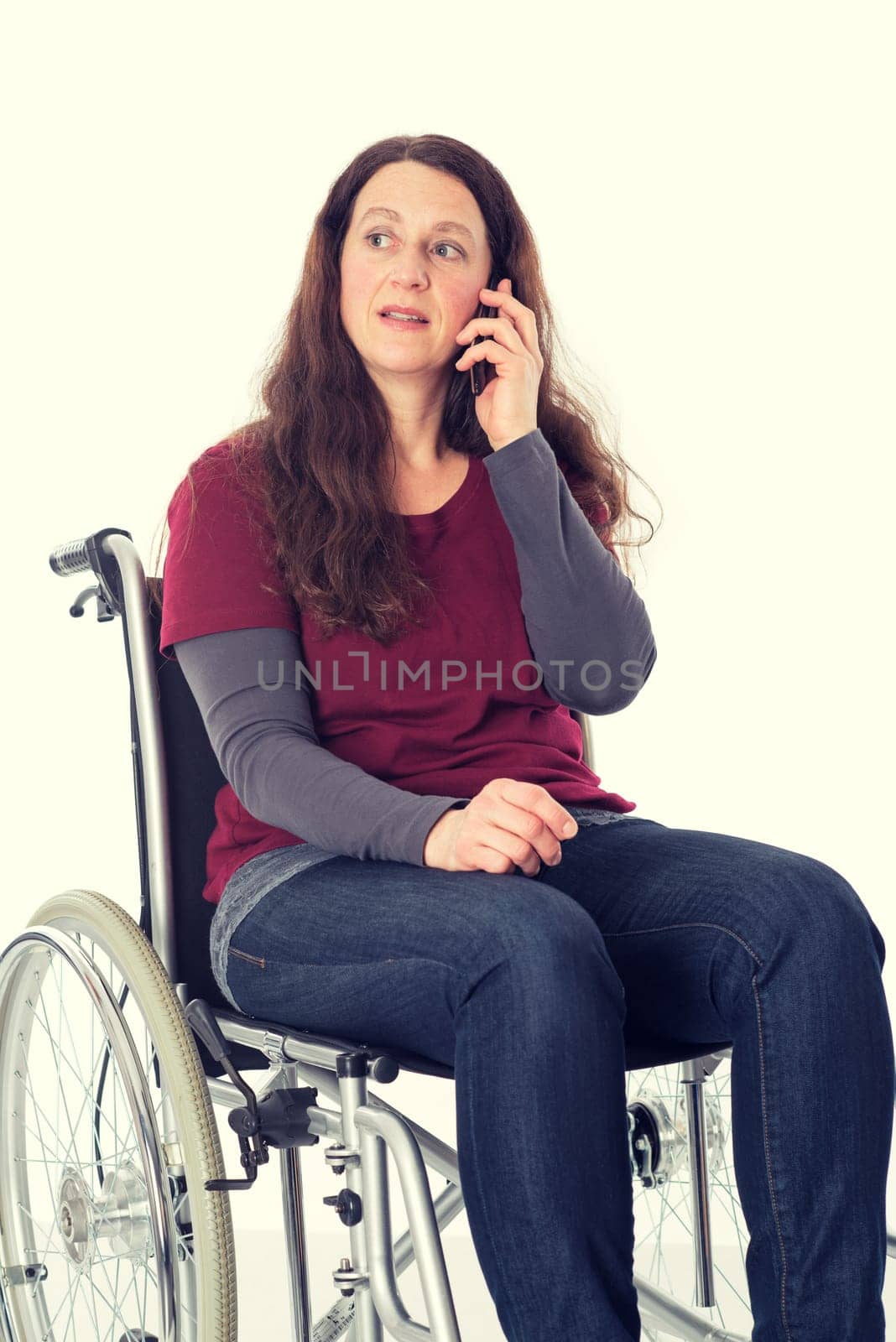 young woman in wheelchair calling with cellphone