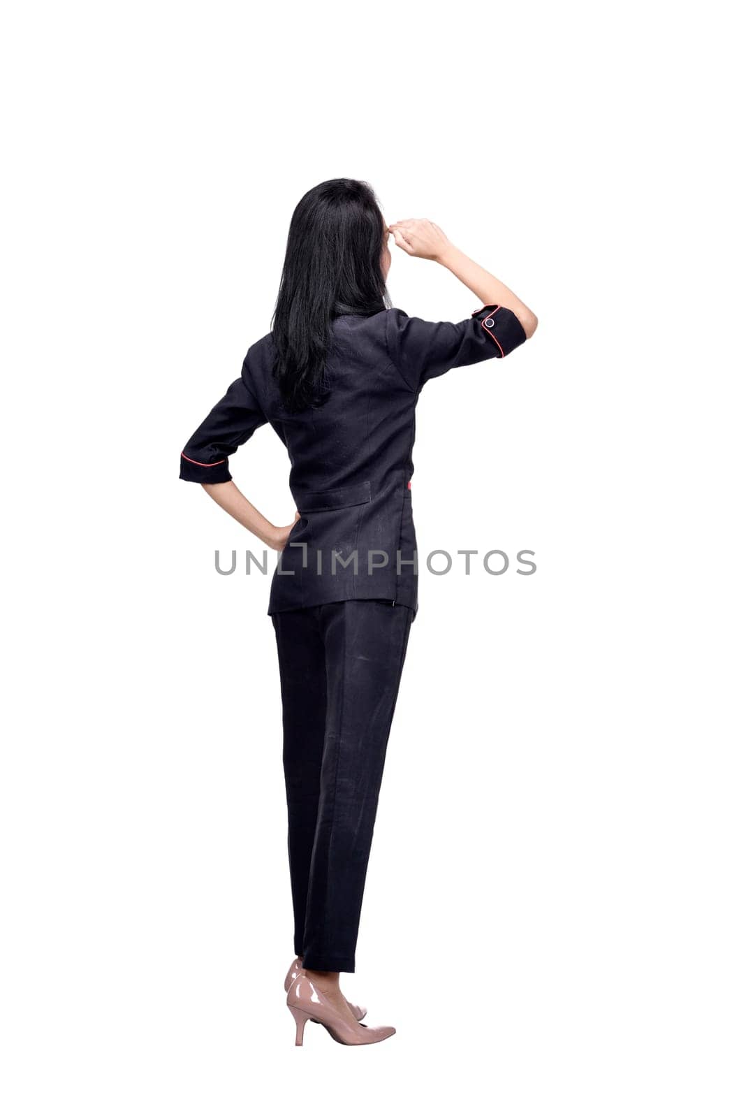 Rear view of asian business woman looking up posing isolated over white background