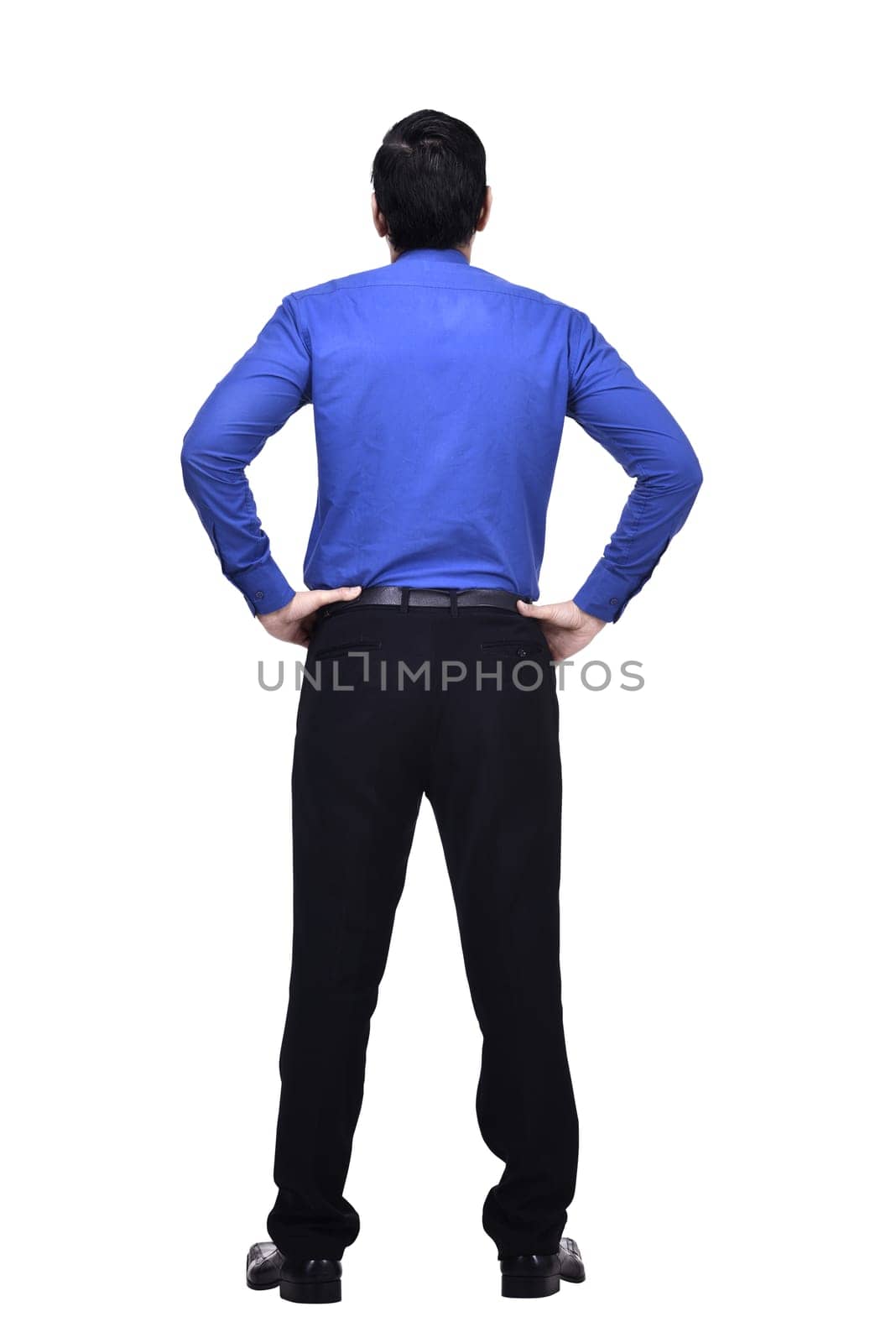 Portrait of asian businessman with hands on waist looking up at something isolated over white background