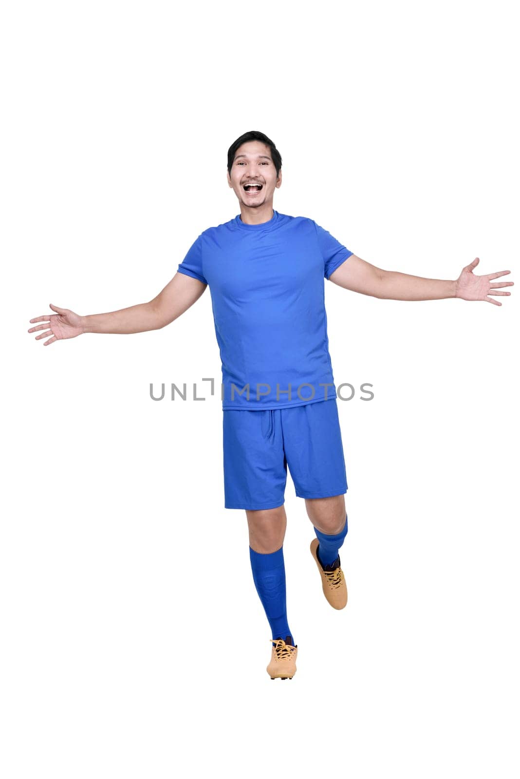 Portrait of asian footballer man with happy expression posing isolated over white background