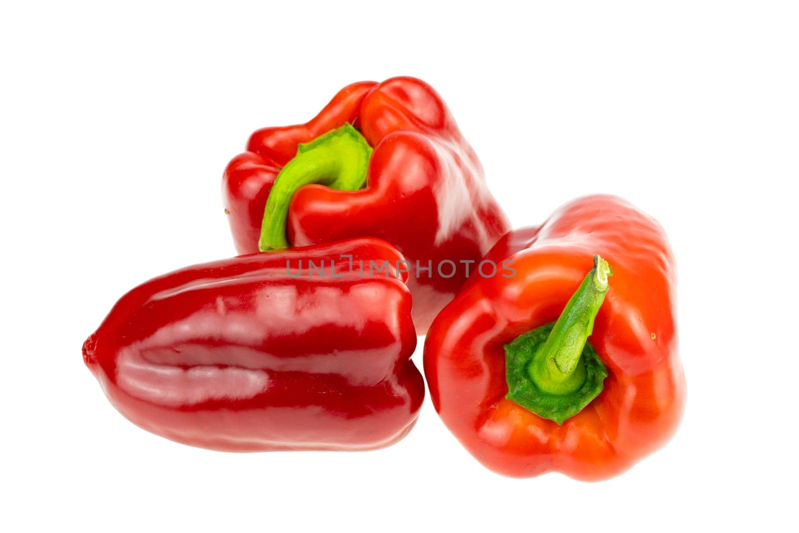 Three Red pepper. Closeup. Isolated on white background.Concept Health.