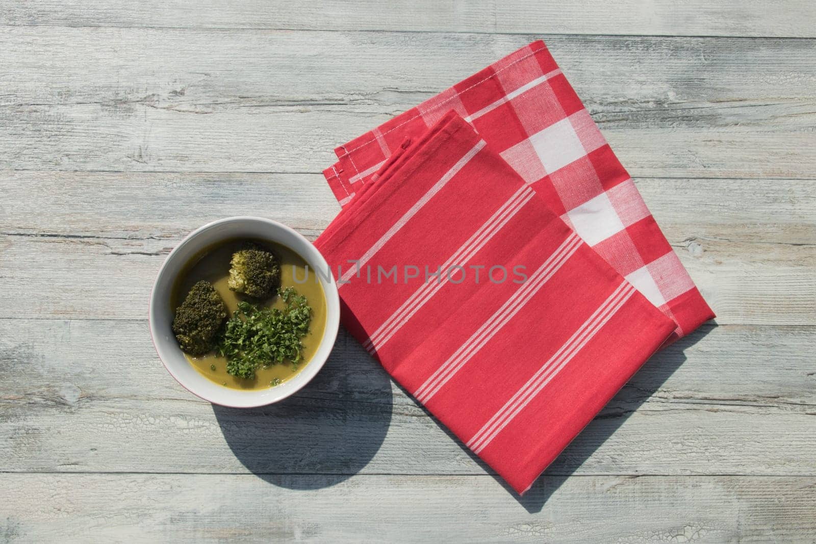Healthy broccoli soup homemade with parsley. Health concept. Top view outdoor.