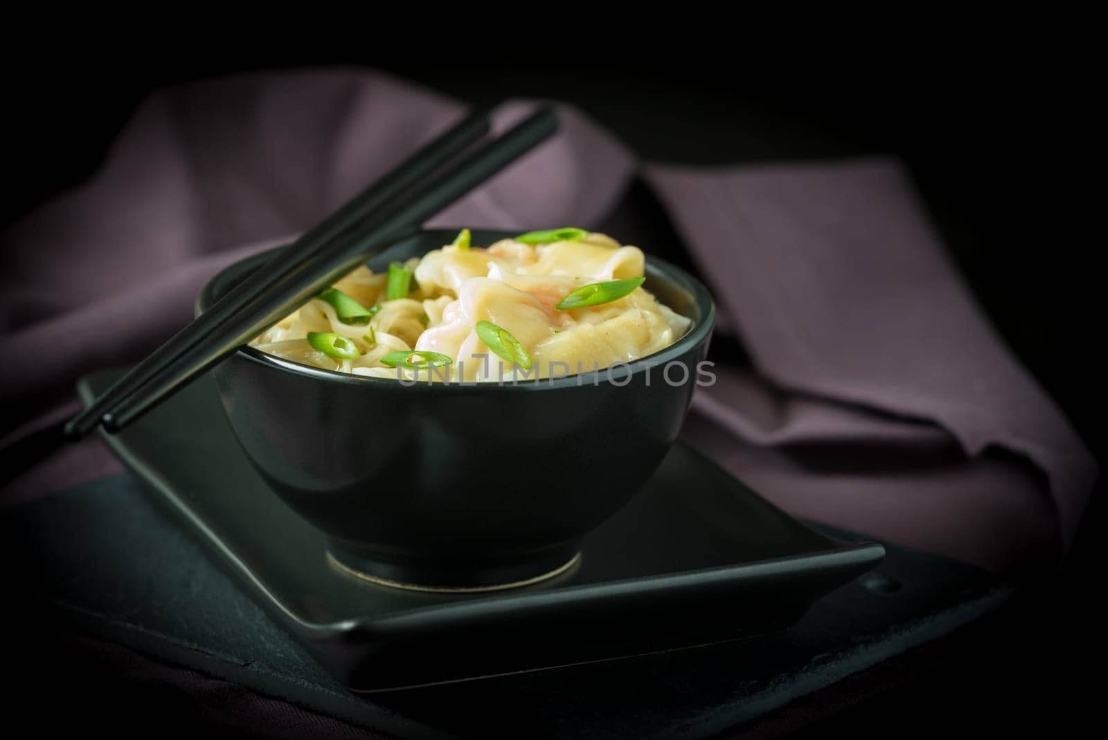 Bowl of chinese shrimp wontons and noodles.
