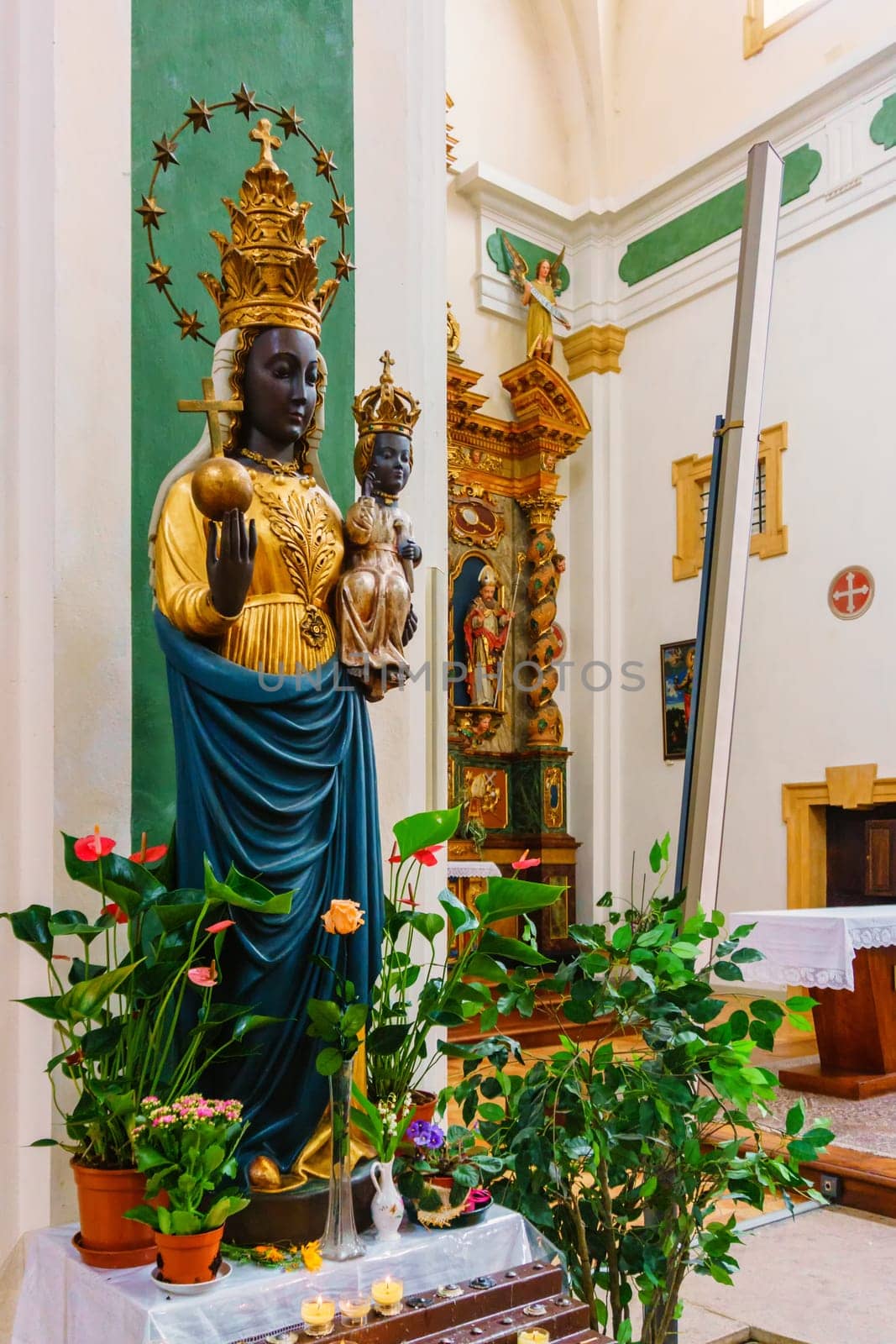France, Annecy - May 01, 2018:Interior of the church with the magnificent statue of the black Madonna. Church of San Francesco di Salesl is the main Catholic place of worship in Annecy, in the Haute-Savoie department.