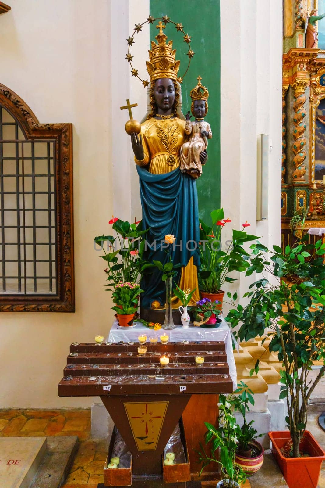 France, Annecy - May 01, 2018:Interior of the church with the magnificent statue of the black Madonna. Church of San Francesco di Salesl is the main Catholic place of worship in Annecy, in the Haute-Savoie department.