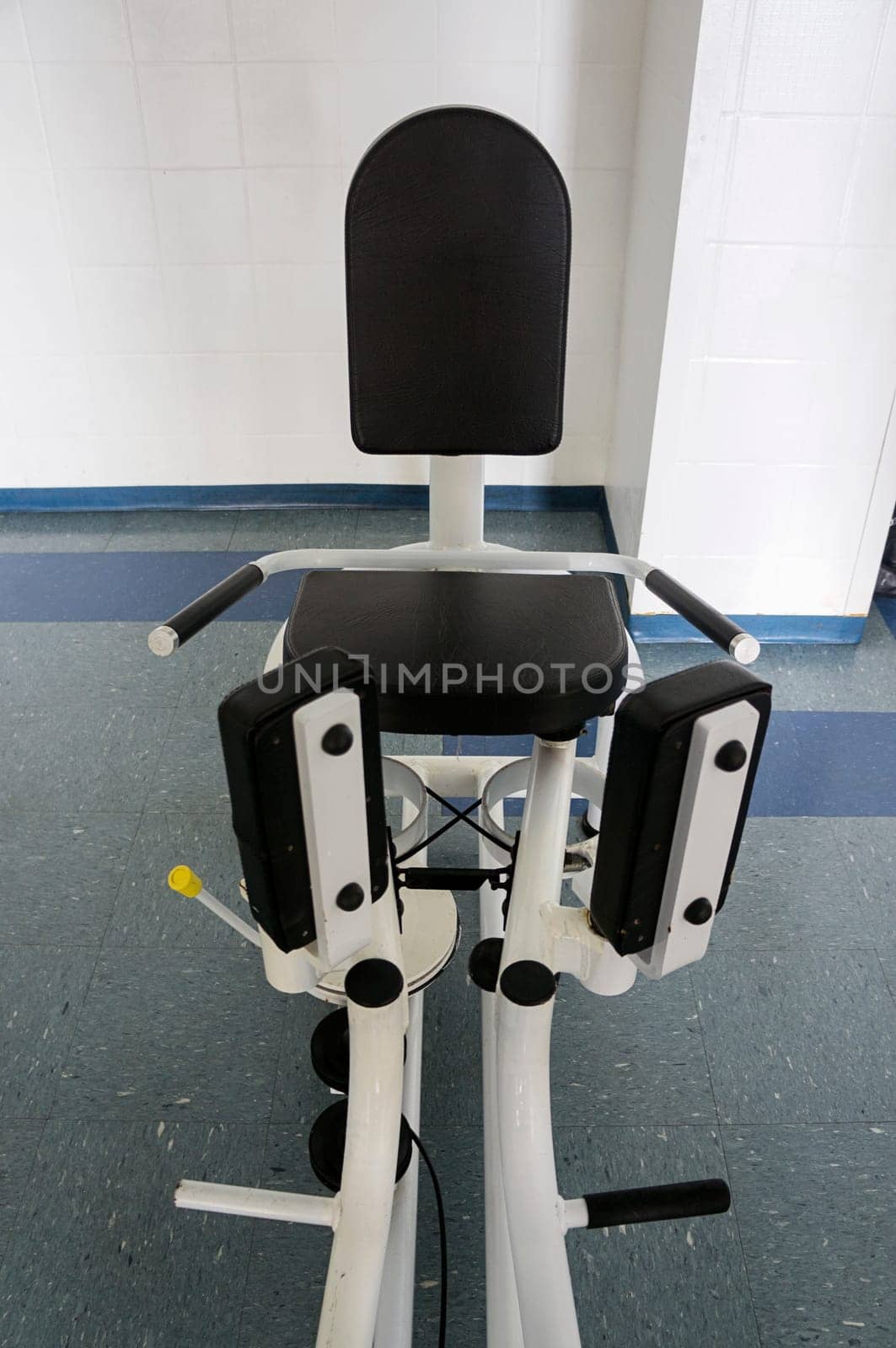 abduction aduction machine indoors gym equipment