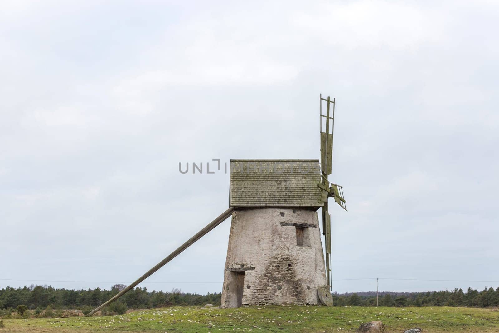 Windmill on Gotland, Sweden with a cloudy sky.