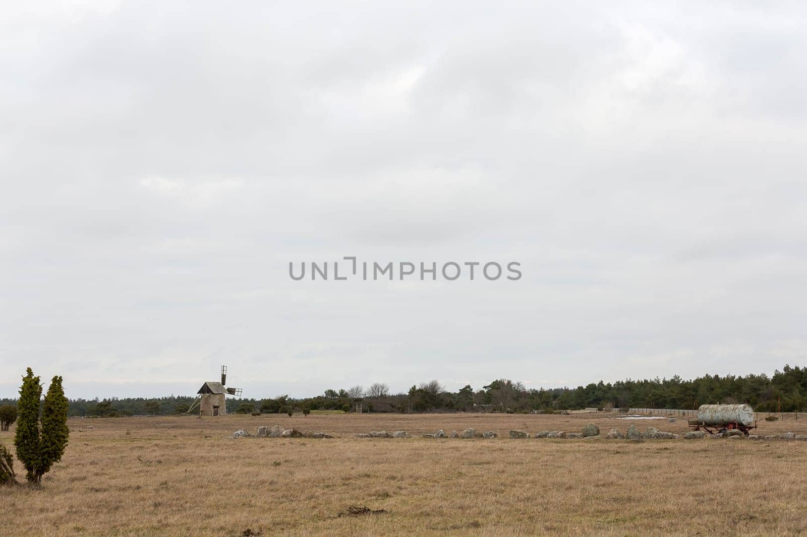 Windmill on Gotland, Sweden with a cloudy sky.