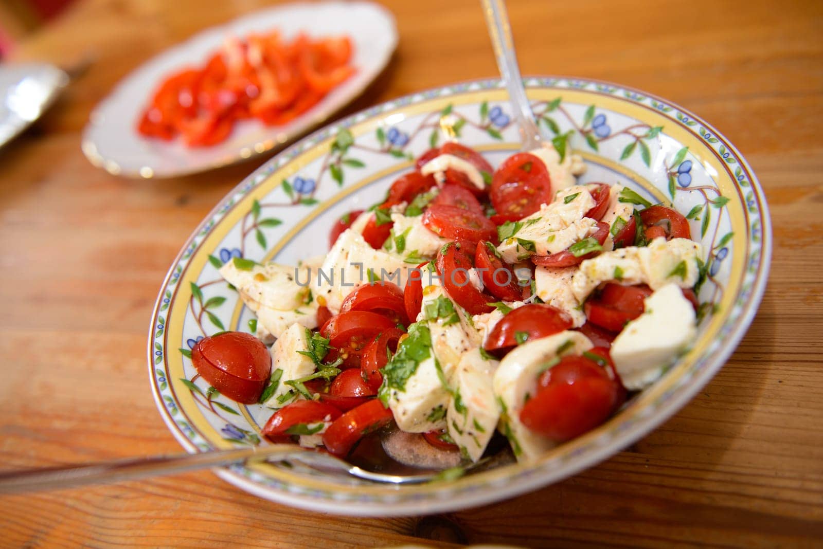 tomato and Mozarella- salad on wooden table