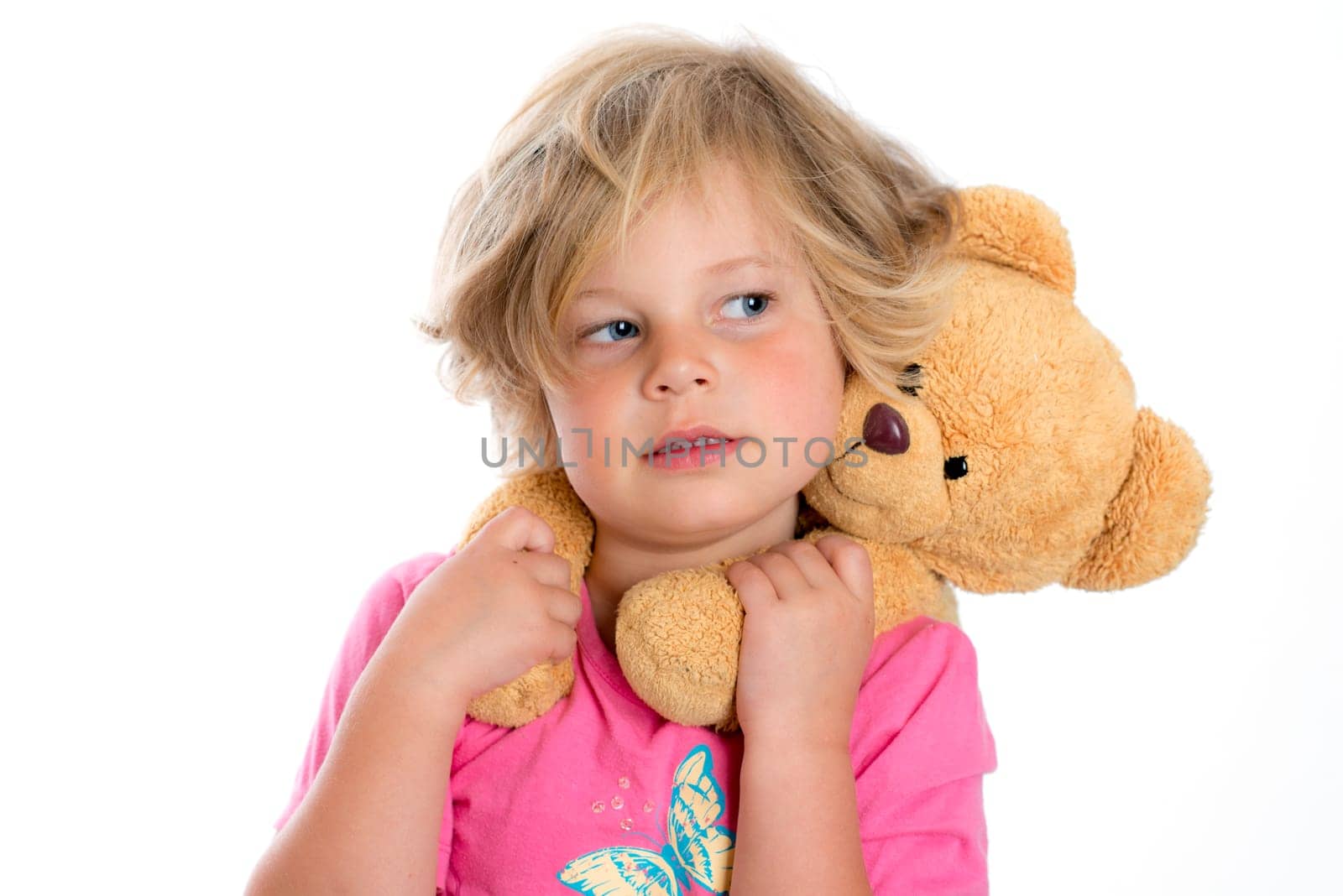 little sweet girl with teddy bear in front of white background