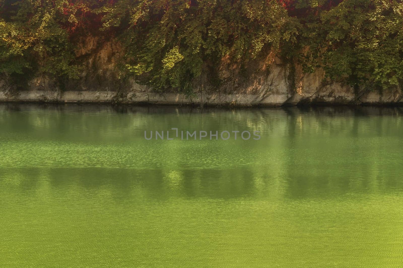 Lake with banks on the site of a former quarry for the extraction of limestone