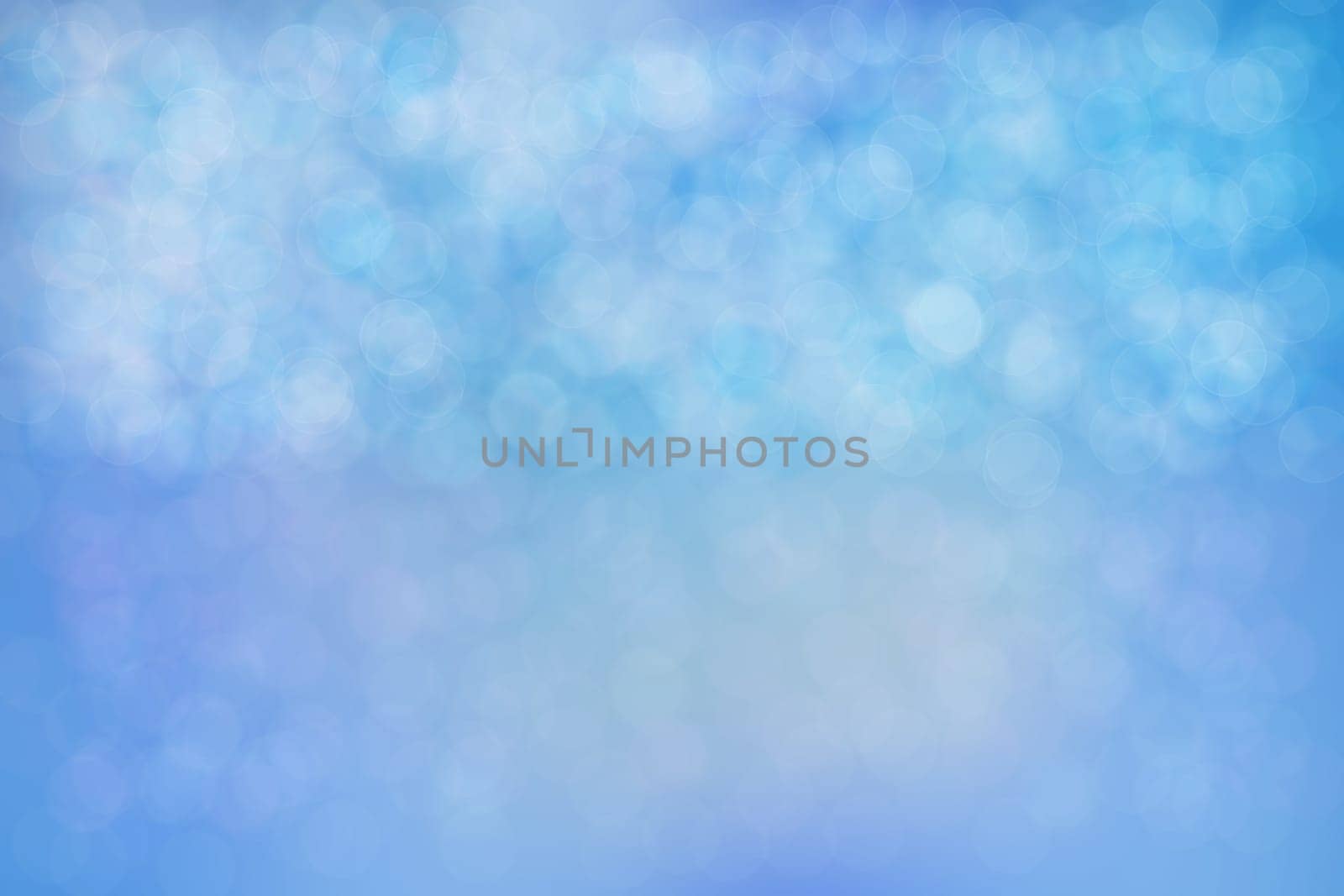 Abstract bright blue bokeh background texture.