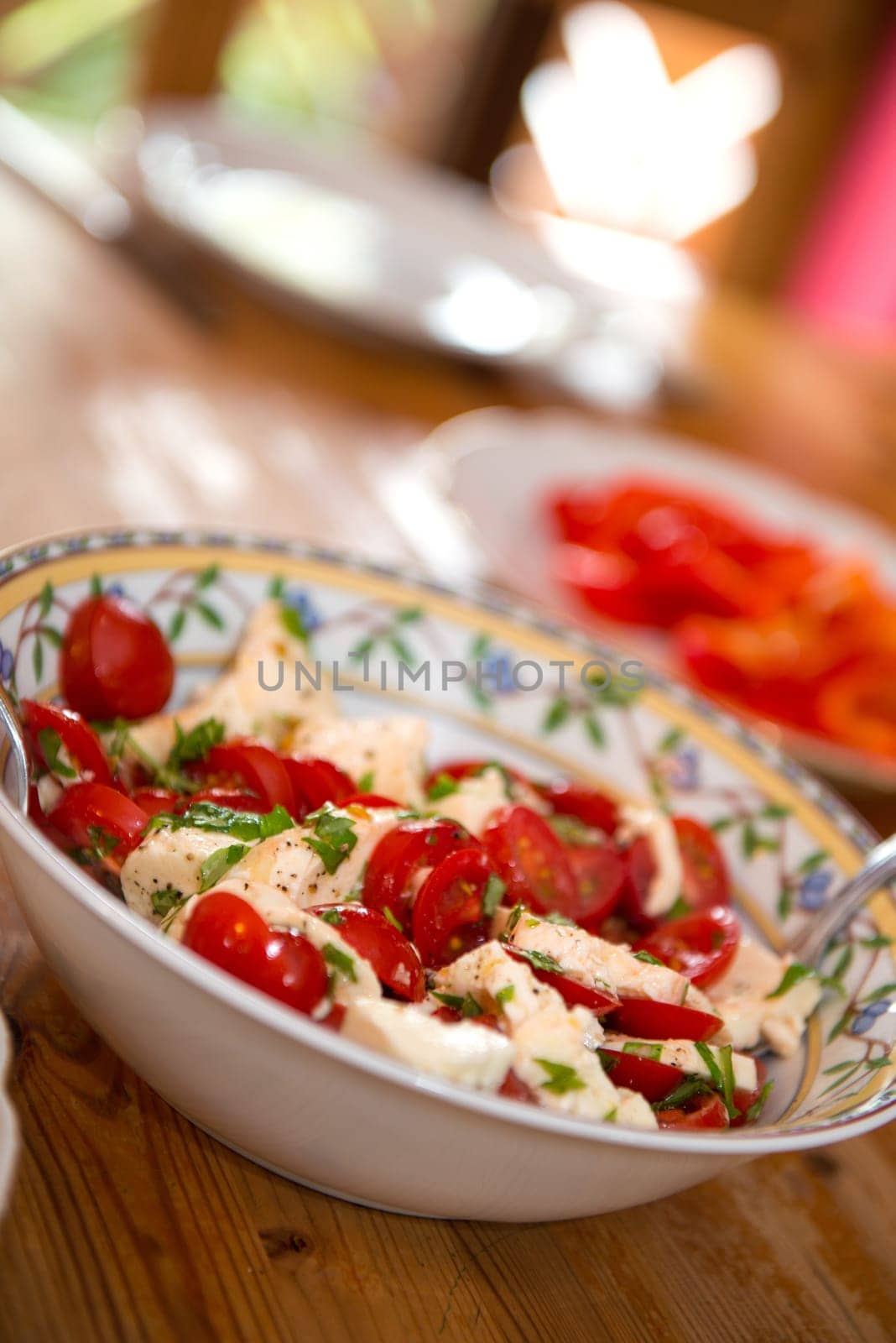 tomato and Mozarella- salad on wooden table