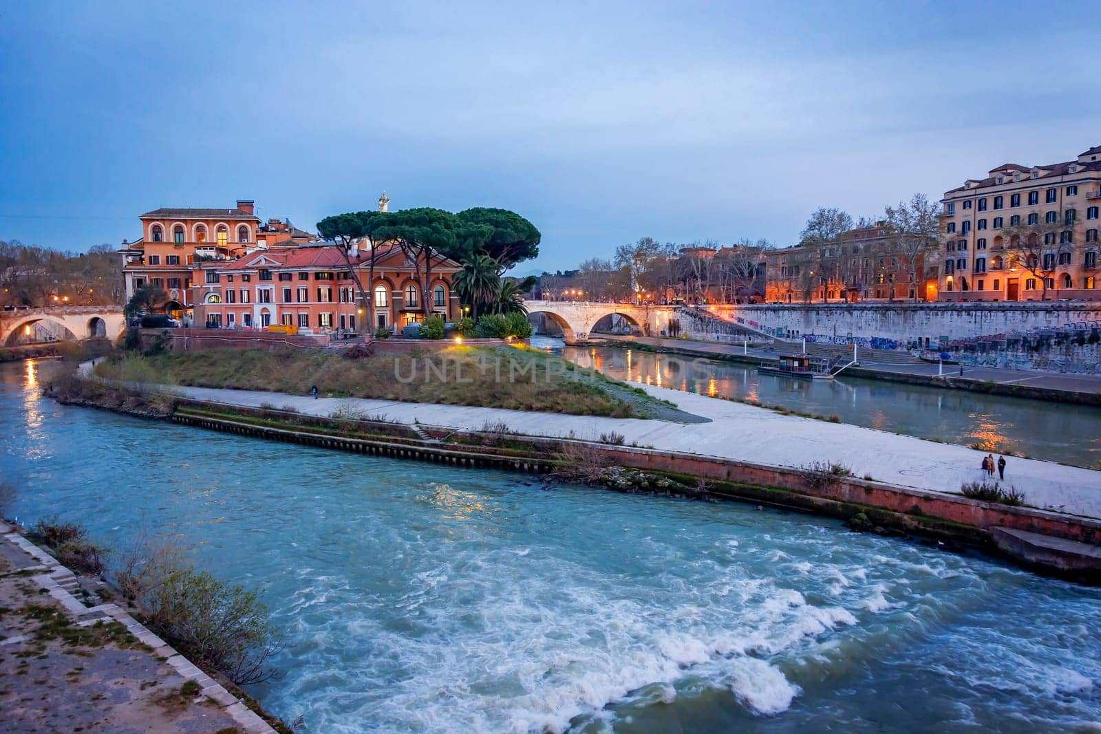 The historical Tiber island from the Garibaldi Bridge in Rome.