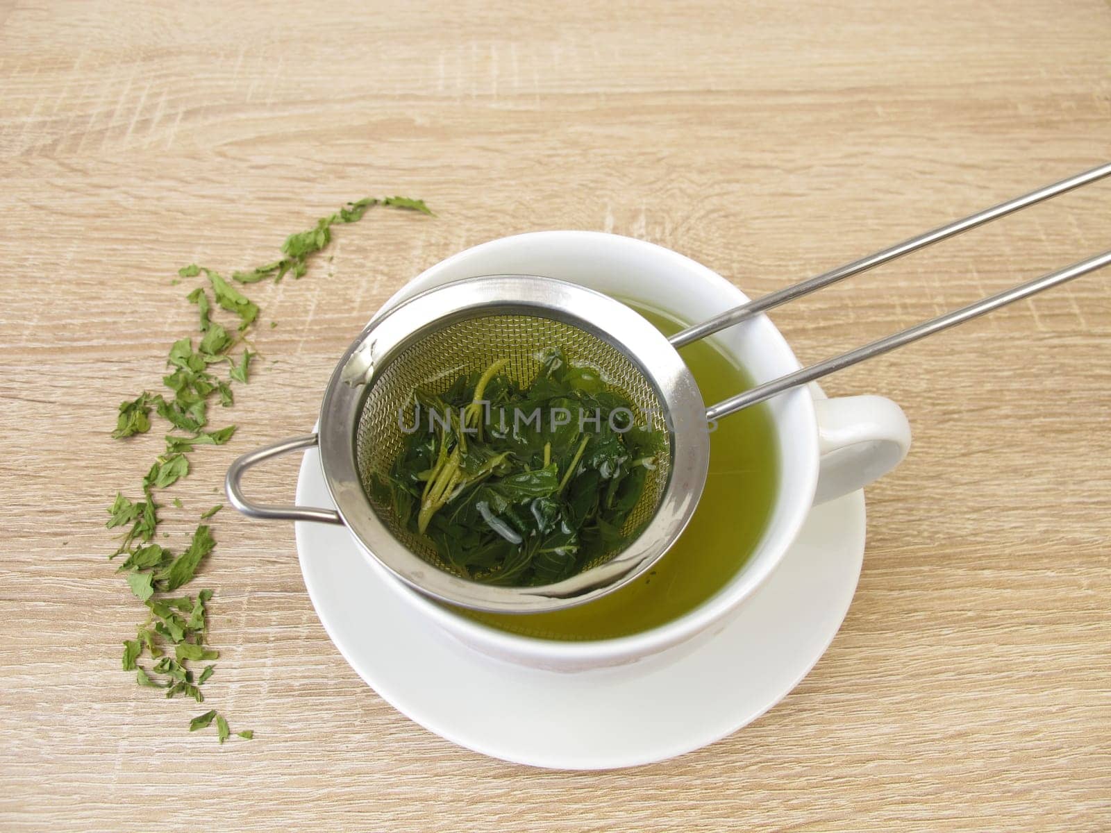 Freshly brewed hemp tea in a tea strainer