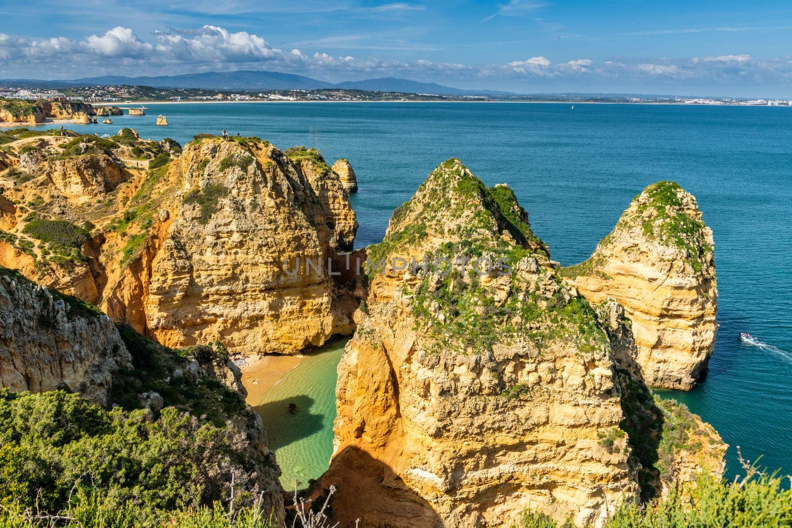 LAGOS, PORTUGAL - CIRCA MAY 2018: Cliffs view by Atlantic Ocean, Lagos, Algarve, Portugal.