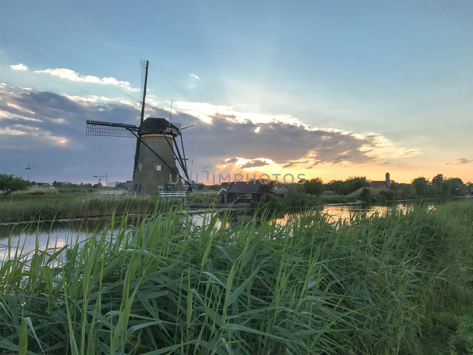 Beautiful dutch windmill landscape at the famous Kinderdijk canals, UNESCO world heritage site
