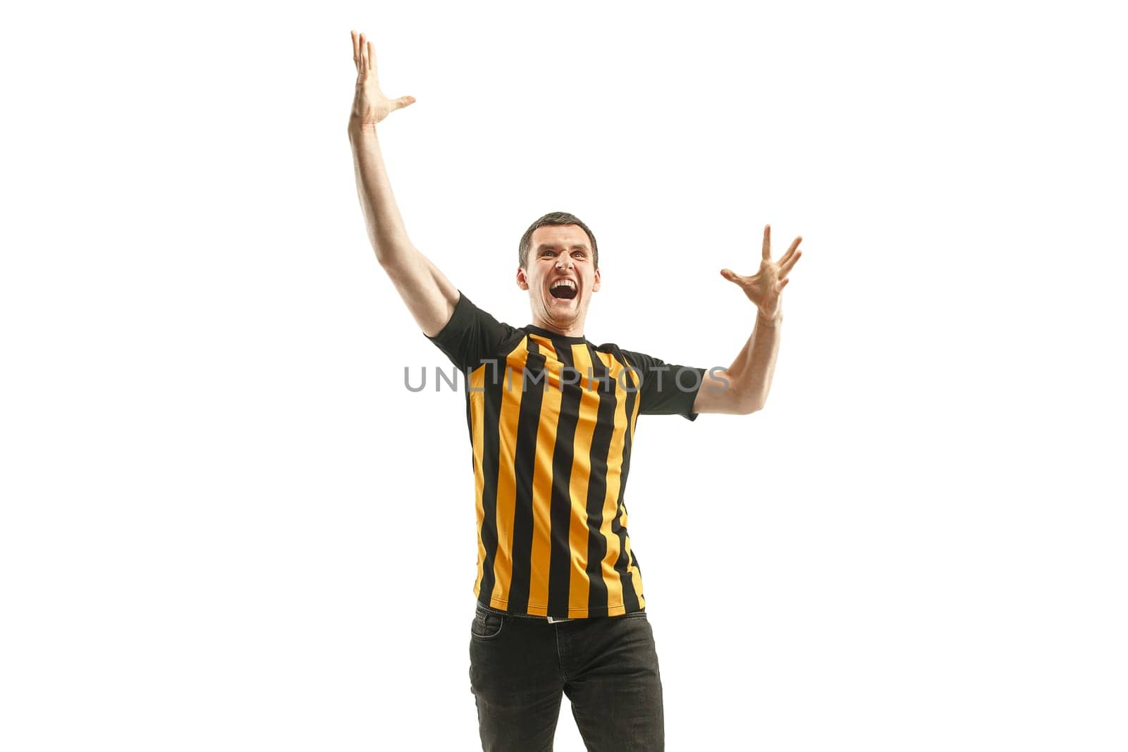 The young Belgian fan celebrating on white background. The young man in soccer football uniform as winner isolated at white studio. Fan, support concept. Human emotions concept.