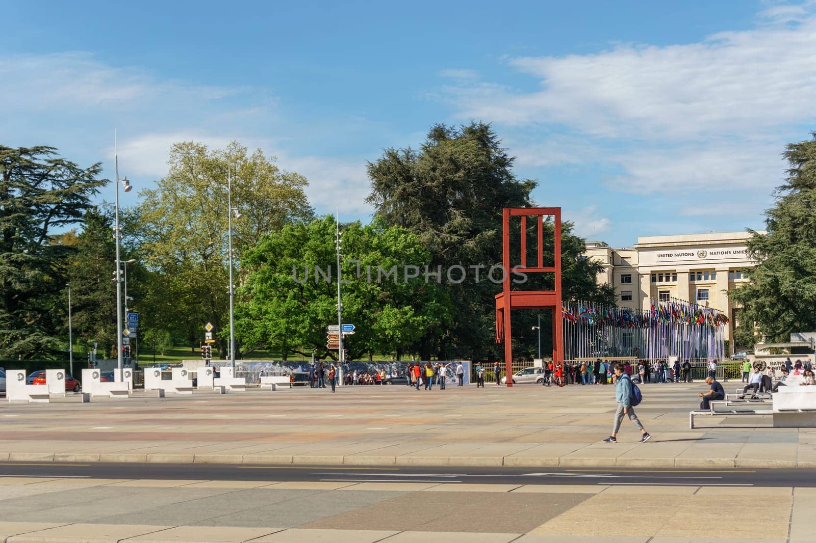 Geneva, Switzerland - April 04,2018: The Place of Nations,  gigantic 'Broken Chair', symbol of the fight against landmines at May 10, 2013 in Geneva, Switzerland. Around are the headquarters of about 250 international organizations. Artist Daniel Berset.