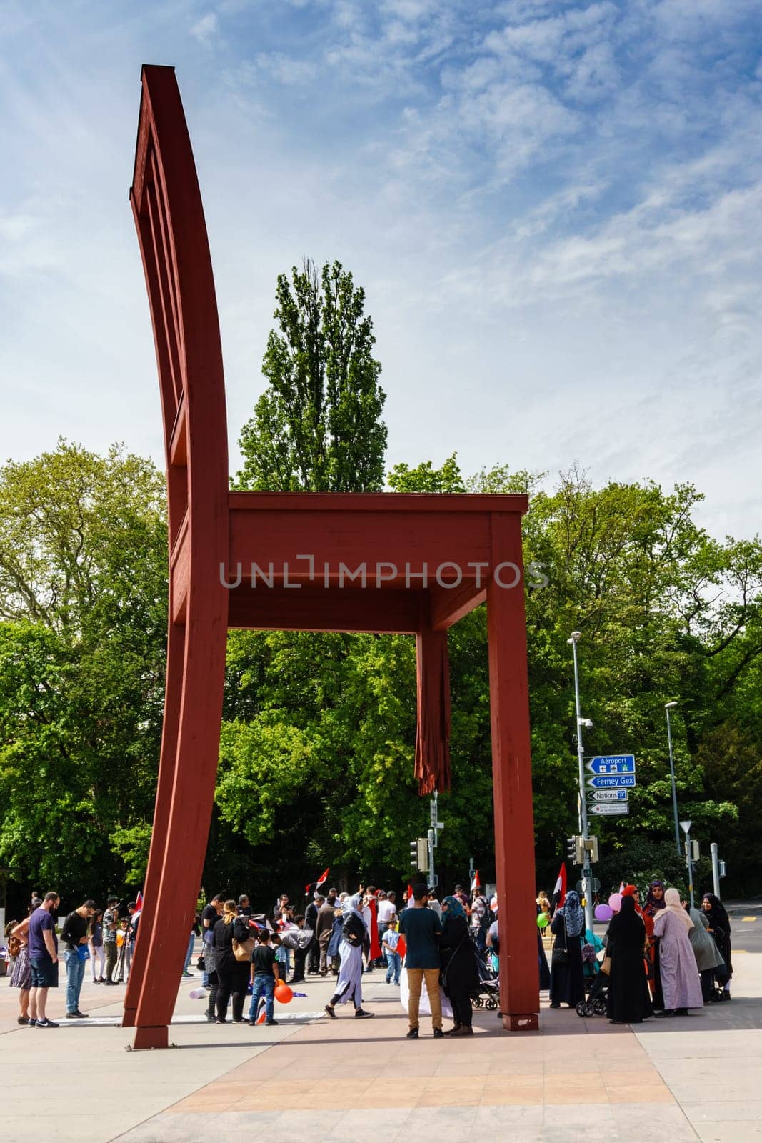 Geneva, Switzerland - April 04,2018: The Place of Nations,  gigantic 'Broken Chair', symbol of the fight against landmines at May 10, 2013 in Geneva, Switzerland. Around are the headquarters of about 250 international organizations. Artist Daniel Berset.