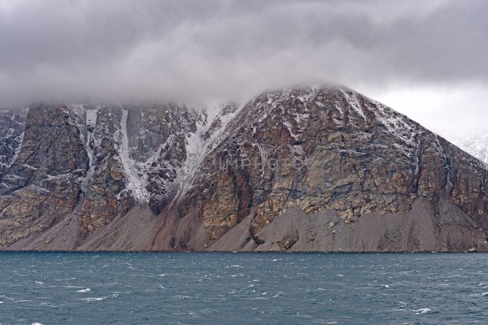 Granite Peaks in the Clouds on the Coast in Sam Ford Fjord on Baffin Island in Nunavut, Canada