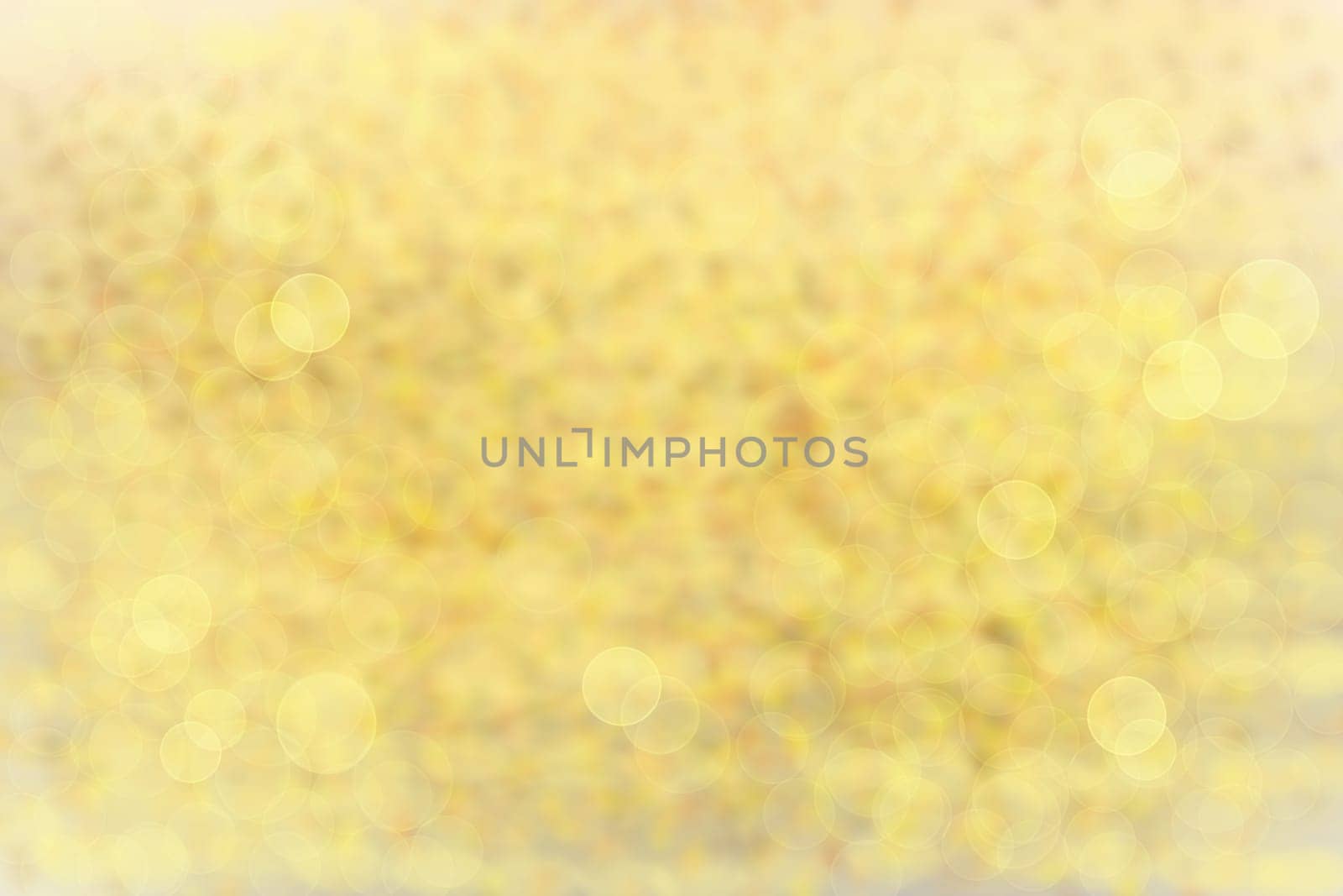 Abstract colorful bright texture bokeh background with golden sheen.