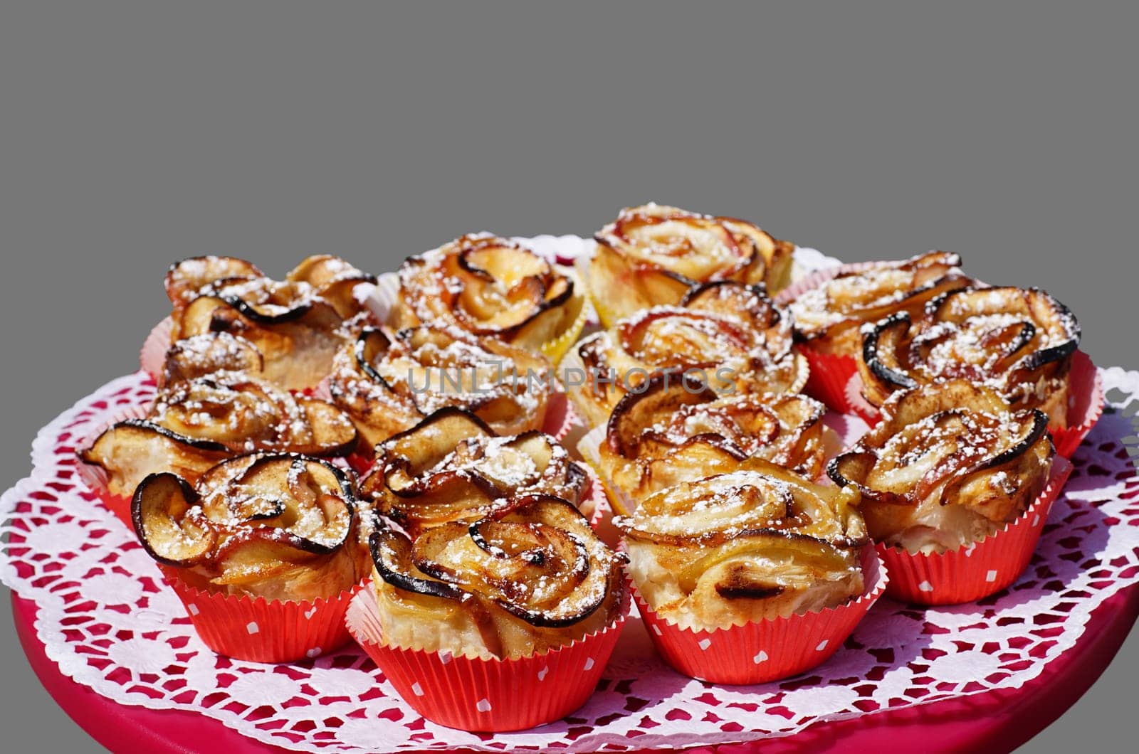 Apple rose muffins on a red cake platter