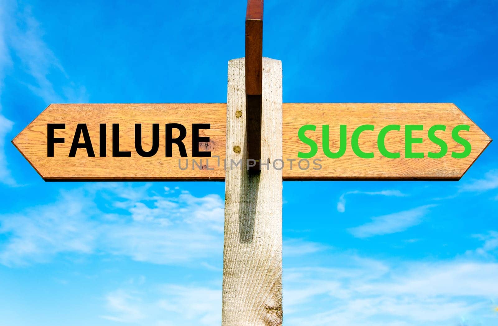 Blank wooden signpost with two arrows over clear blue sky with copy space, just add your text here