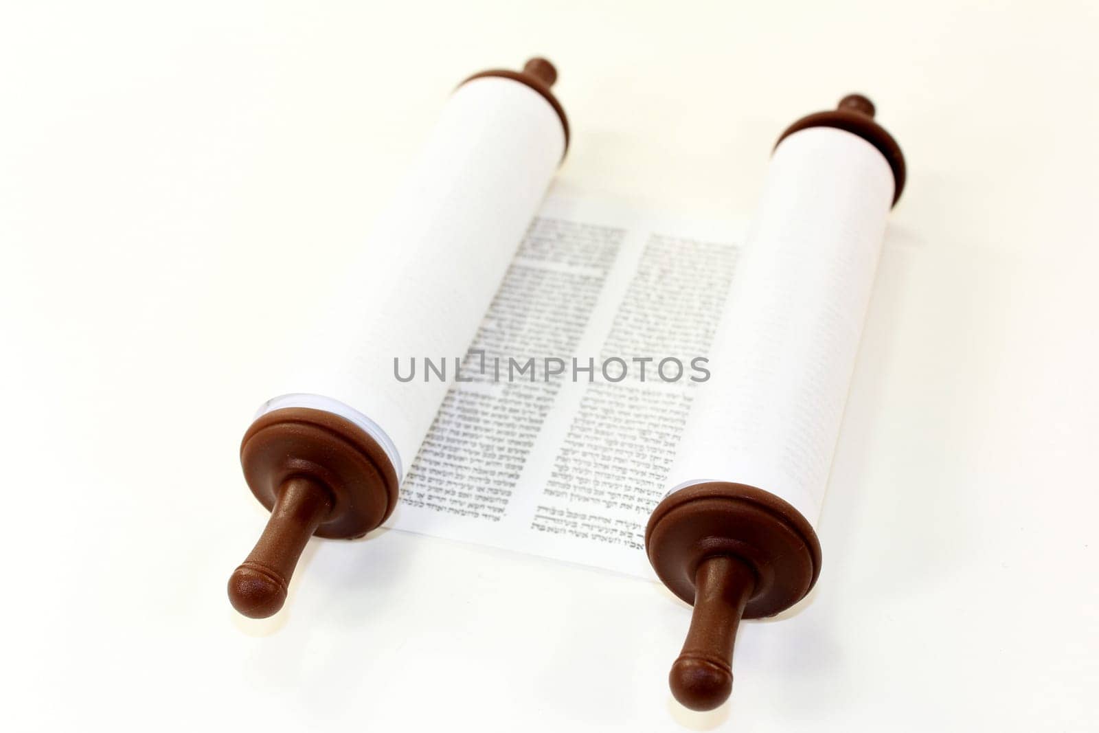 a torah roll against a white background
