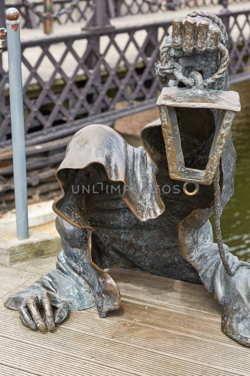 KLAIPEDA, LITHUANIA - JULY 05, 2017: The Black Ghost bronzed sculpture (designed by Svajunas Jurkus and Sergejus Plotnikovas). Danes river quay. Klaipeda Old Town residential district. Lithuania