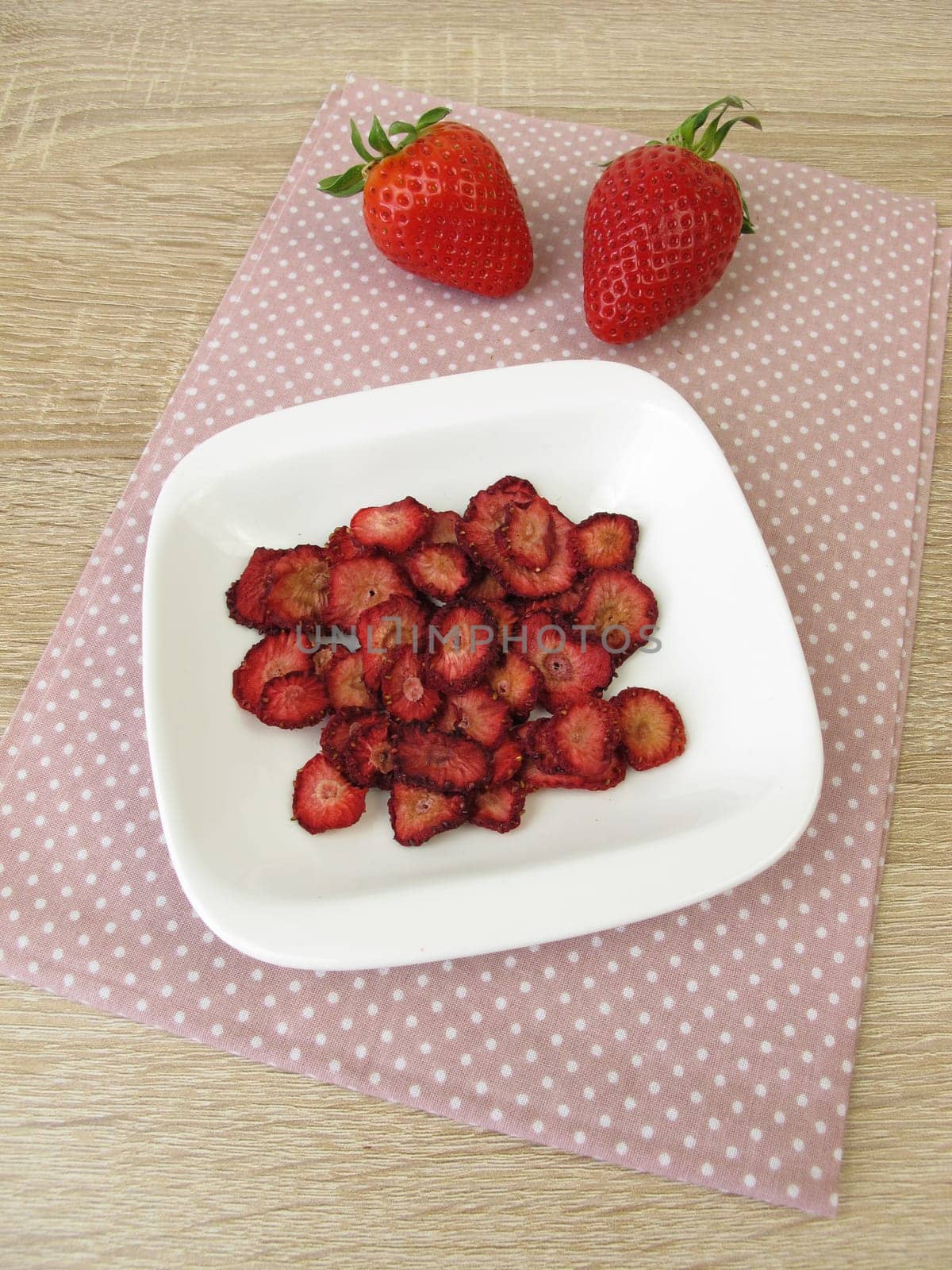 Fresh and self-dried strawberries
