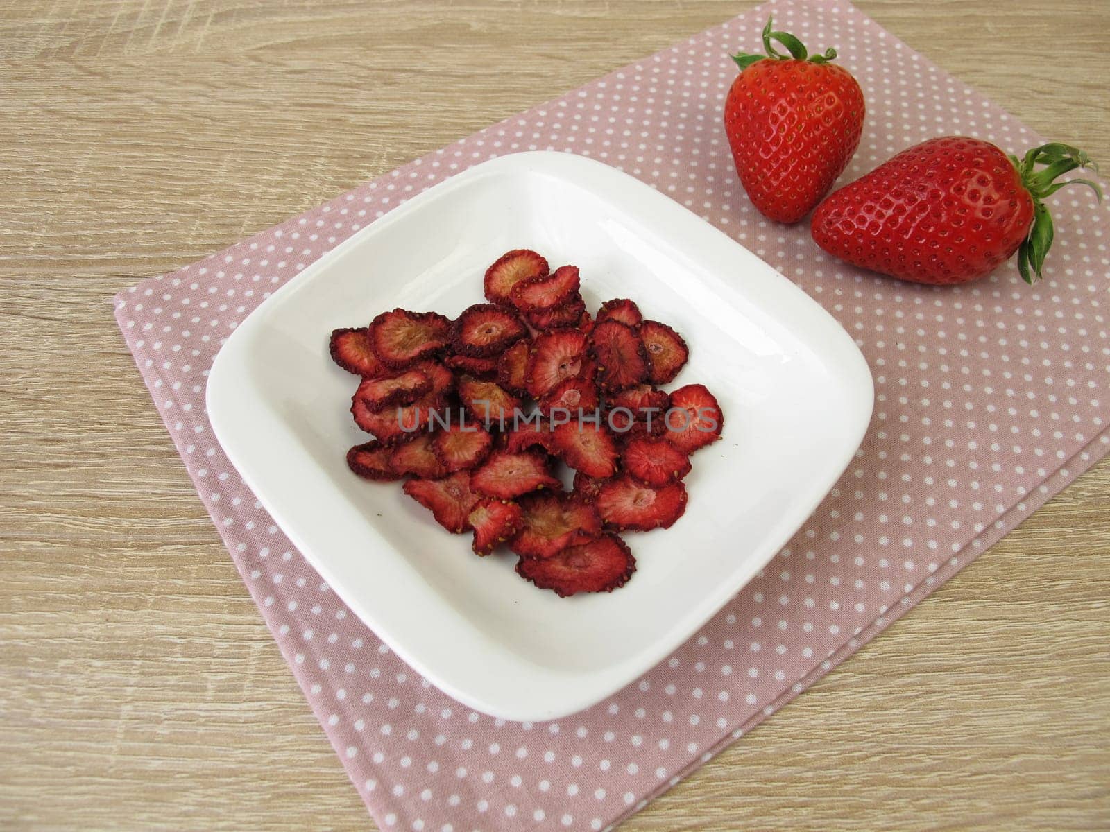 Fresh and self-dried strawberries