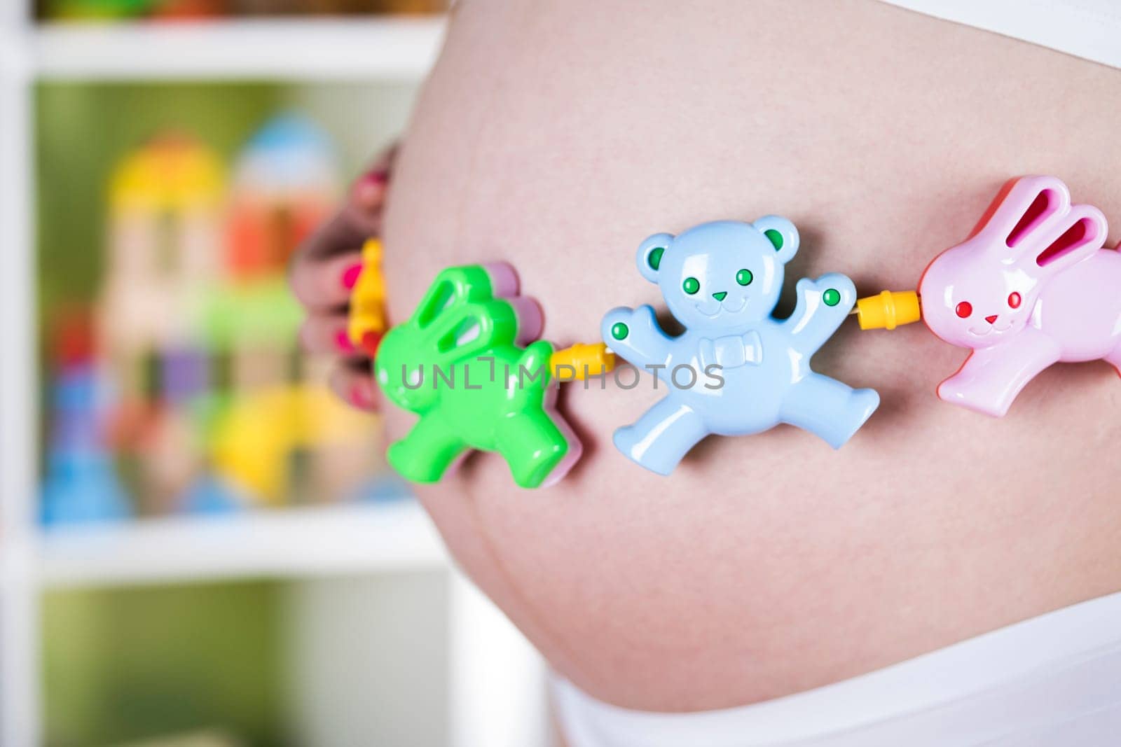 Pregnant woman with a toy