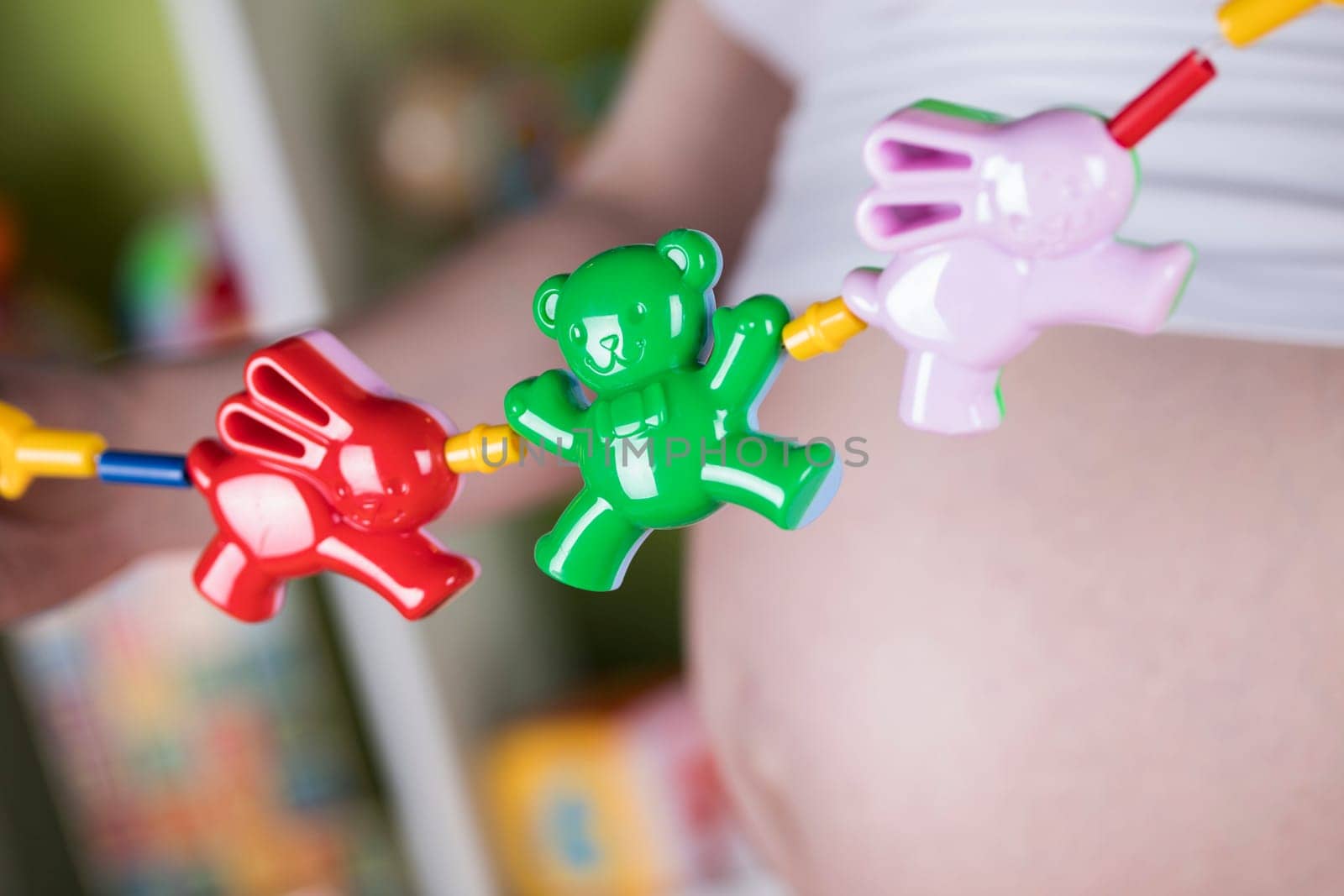 Pregnant woman with a toy