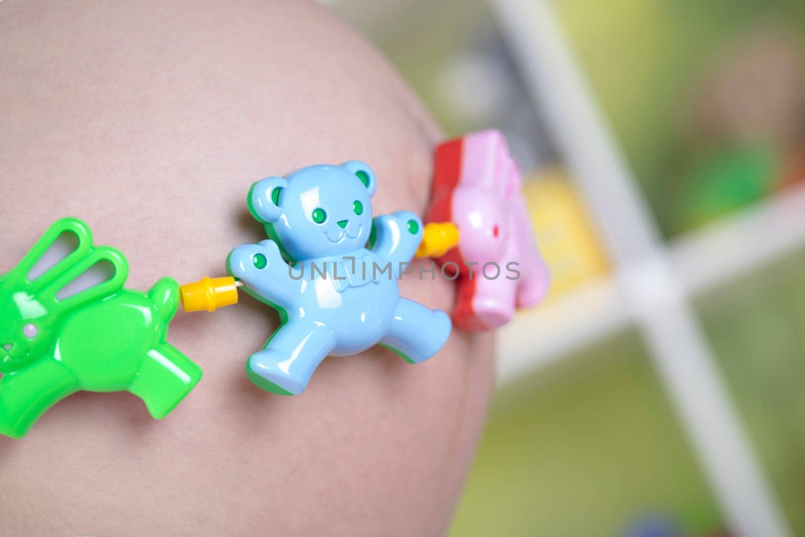 Pregnant woman with a toy