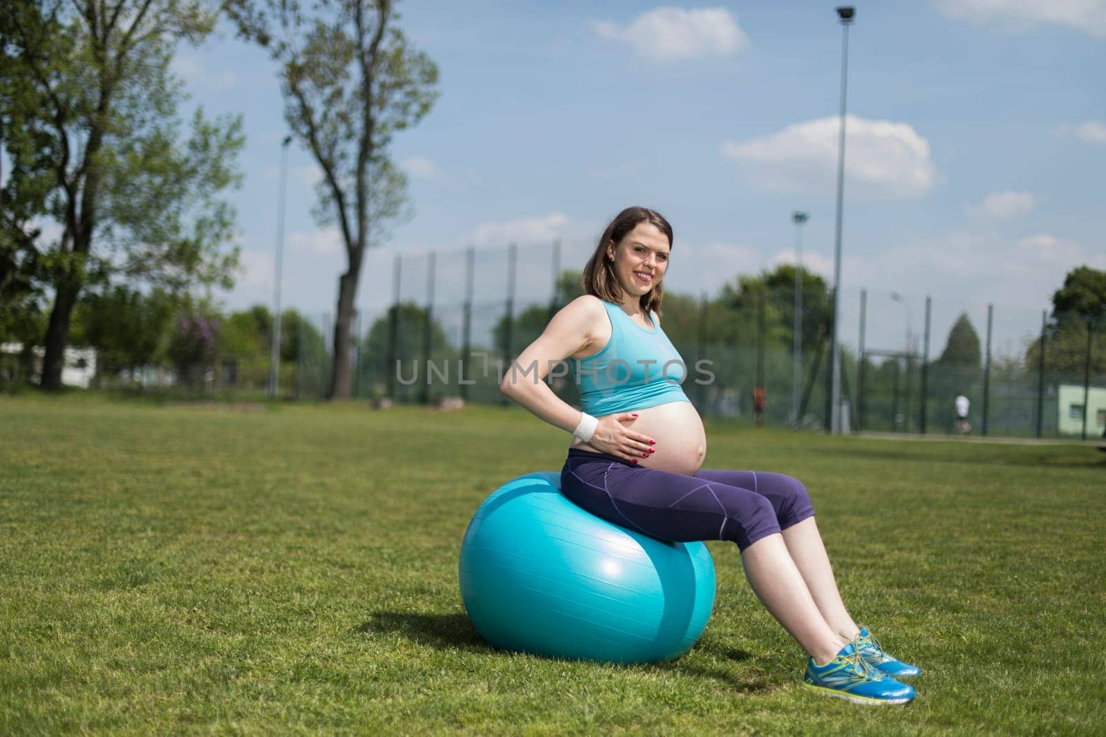 Pregnancy, sport, fitness, people and healthy lifestyle concept