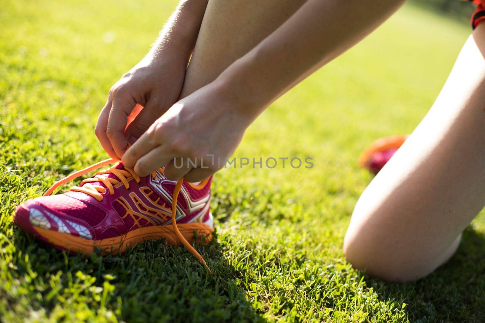 Runner feet running on road closeup on shoe
